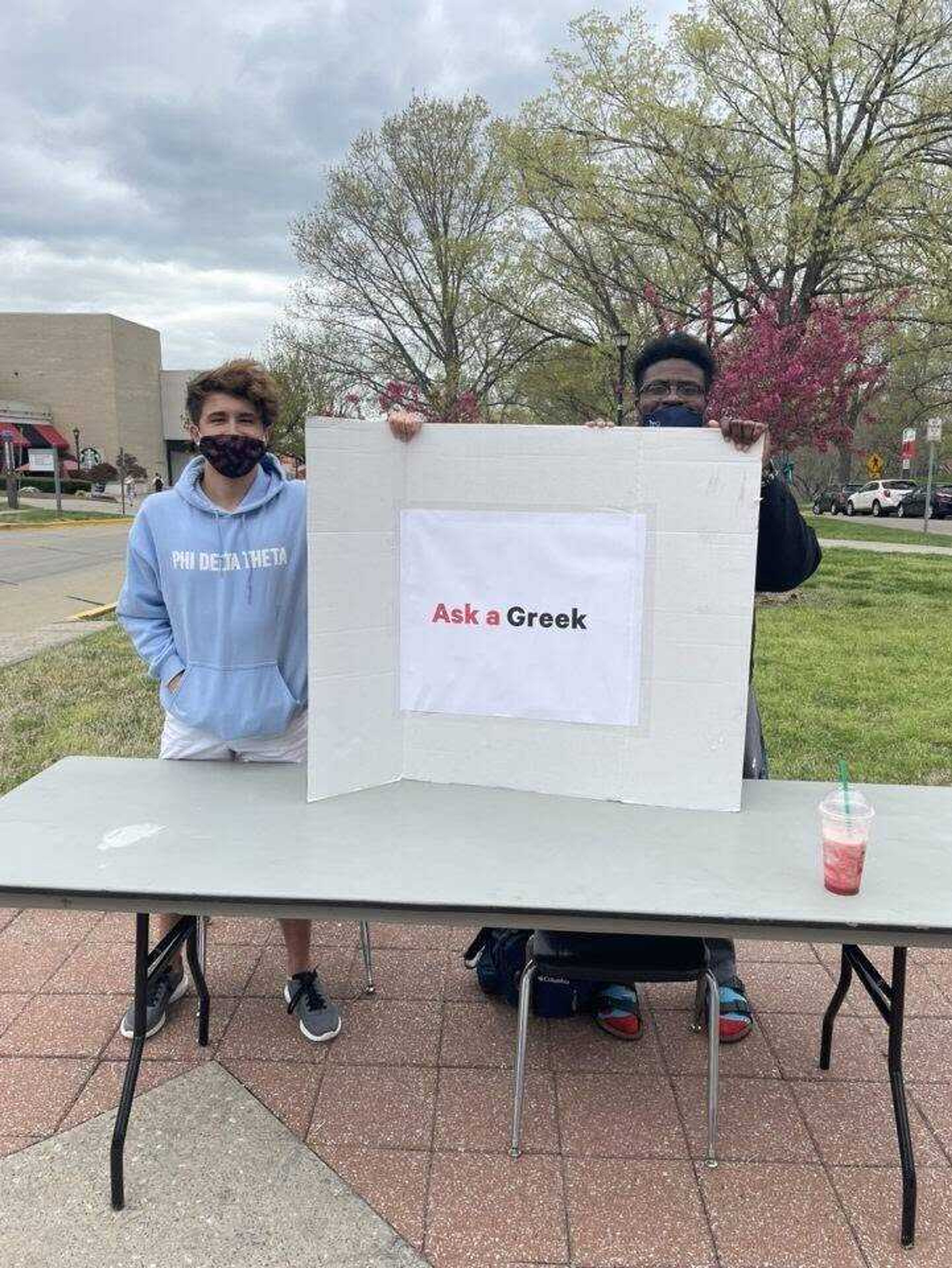 Co-organizer of the “Ask a Blank” event, Justin Tuschoff (left), and Theta Xi representative Kelvin Johnson at the “Ask a Greek” table on April 8.