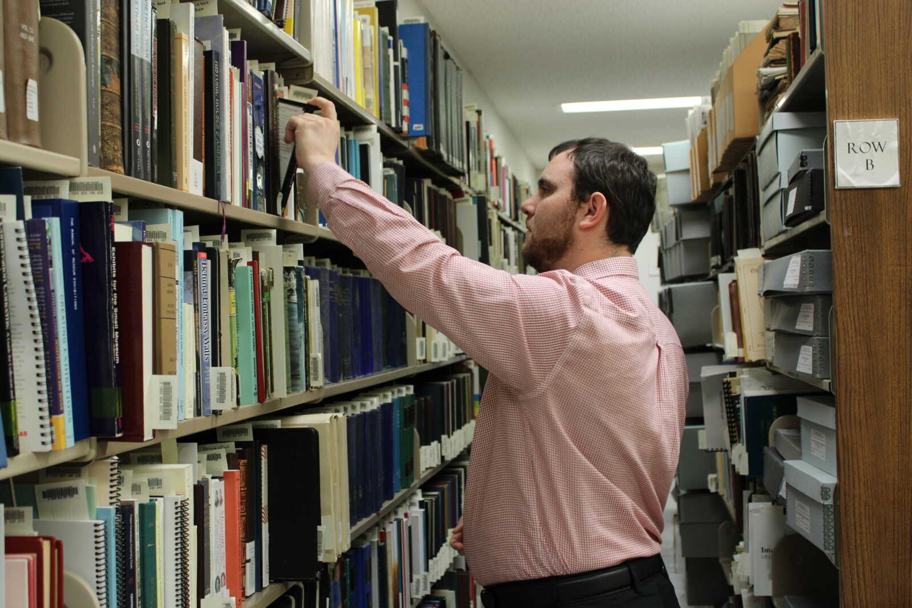 Special Collections and Archives librarian Tyson Koenig looks through SEMO's archives for preserved images and records.