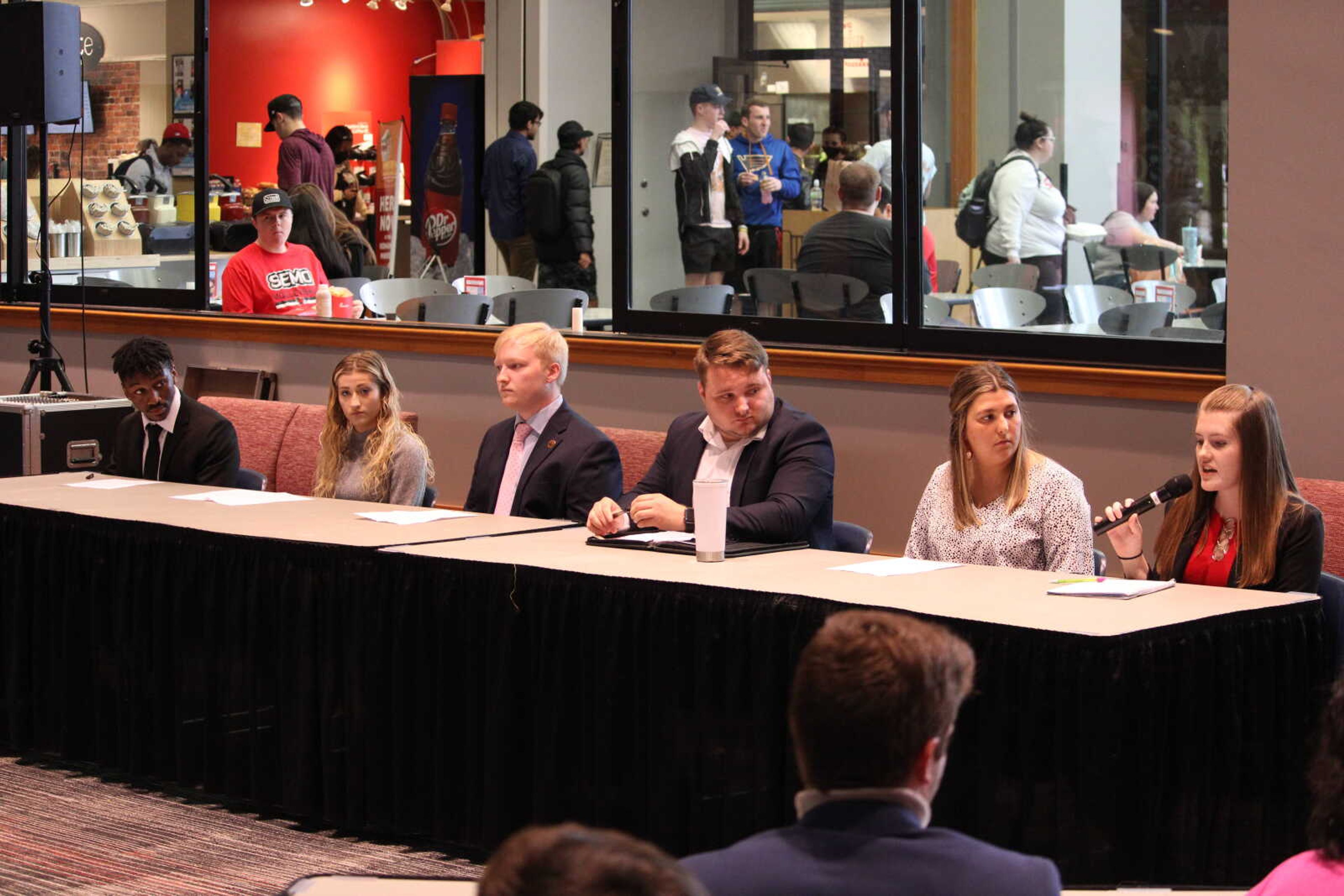 [From Left to Right] SGA election candidates Tyrell Gilwater, Sophie Machen, Luke Collins, Joel Philpott, Natalie Augustyn and Heather Hoffman participate in a debate on March 30. The debate was hosted by SGA and allowed students to learn more about the candidates wanting to represent them.