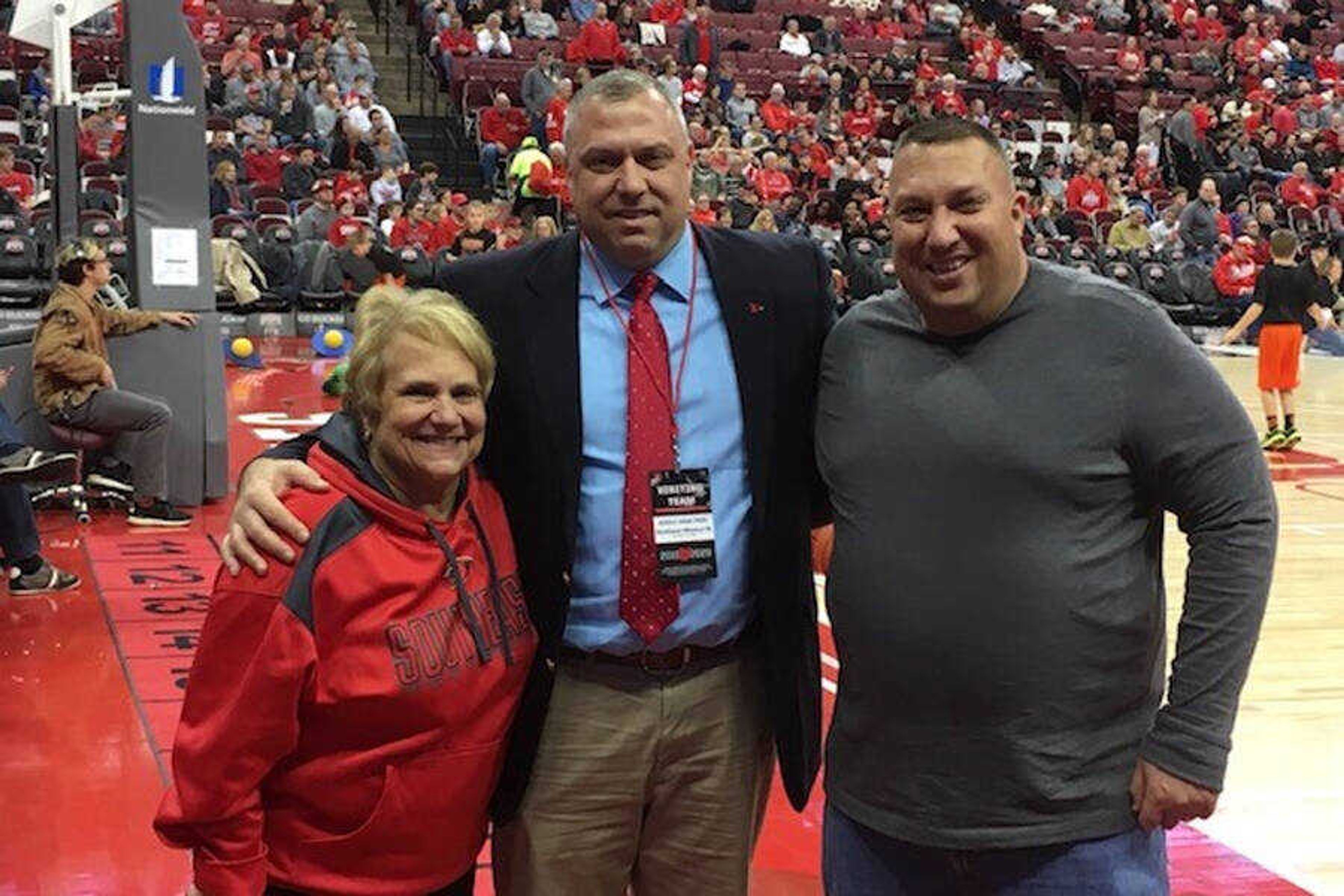 Jeff Honza (Middle), with his mother, Terri (Left), and his brother, Patrick (right) at the Redhawks basketball game vs Ohio State on Dec. 17, 2019.