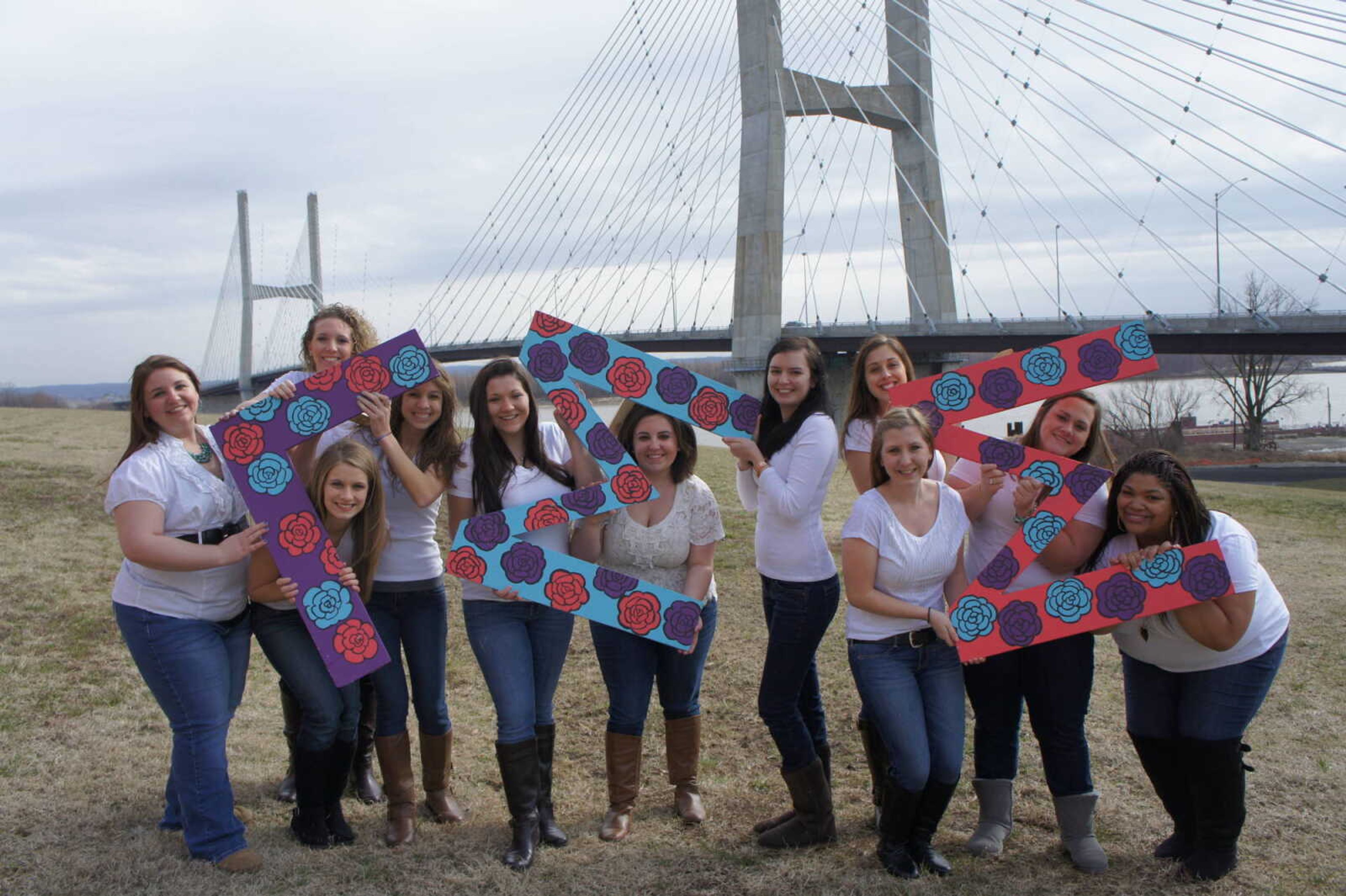  Katelyn Glenn (middle), president of Gamma Sigma Sigma from Fall 2012 - Spring 2013 posing with the
executive board. Submitted Photo