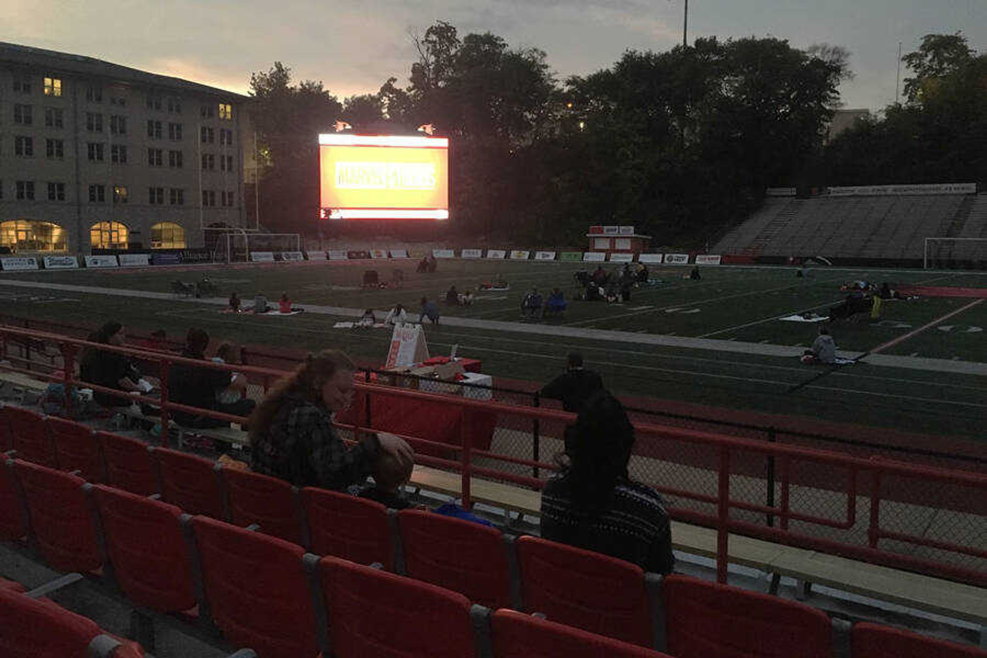 People prepare for “Black Panther” to start at Houck Field on Oct. 9, 2020. Viewers sit either in the stands or the fields.