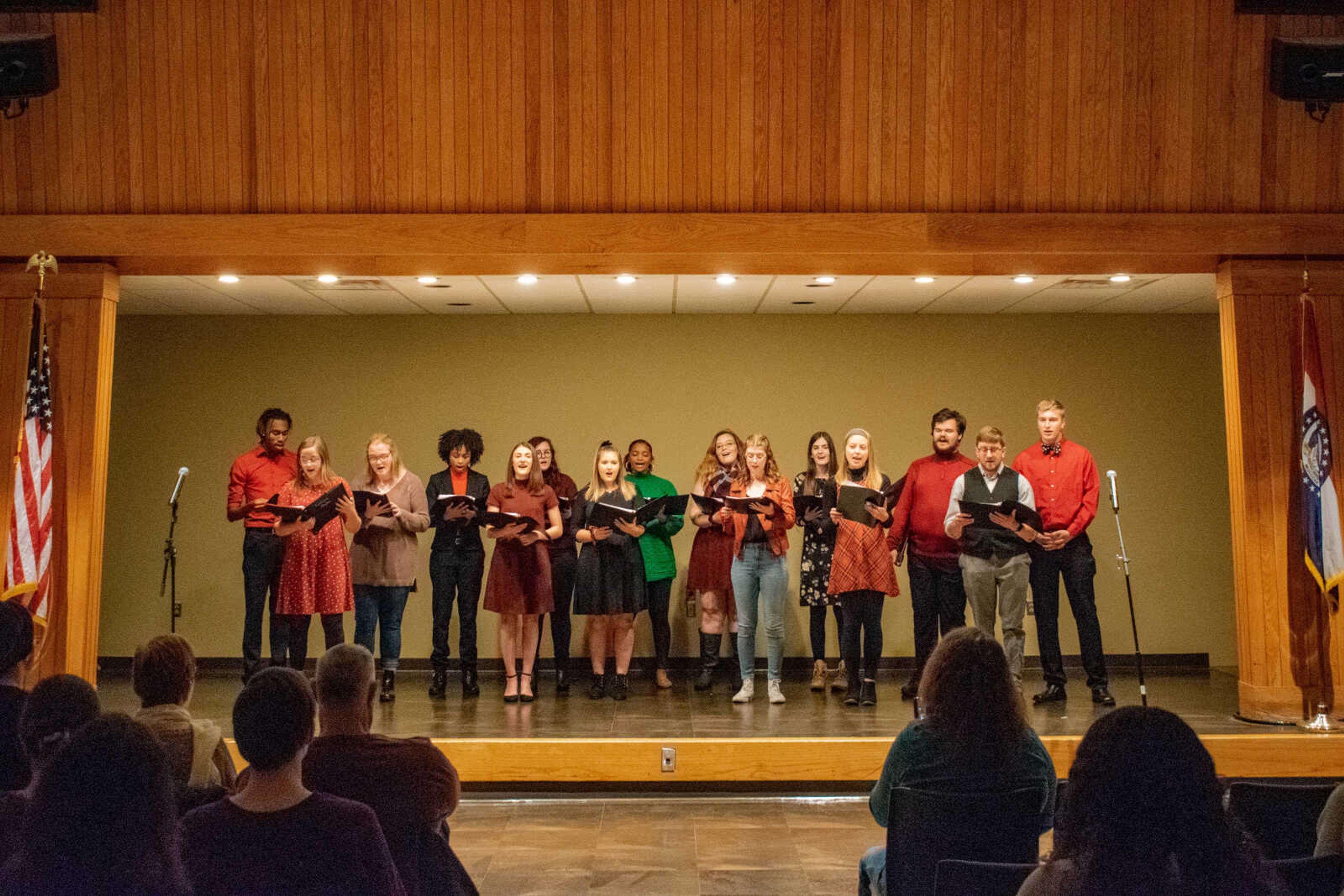 Redhawk Rhythm A Cappella Singers performing Christmas songs at their holiday concert on stage in the University Ballroom on Dec. 3.