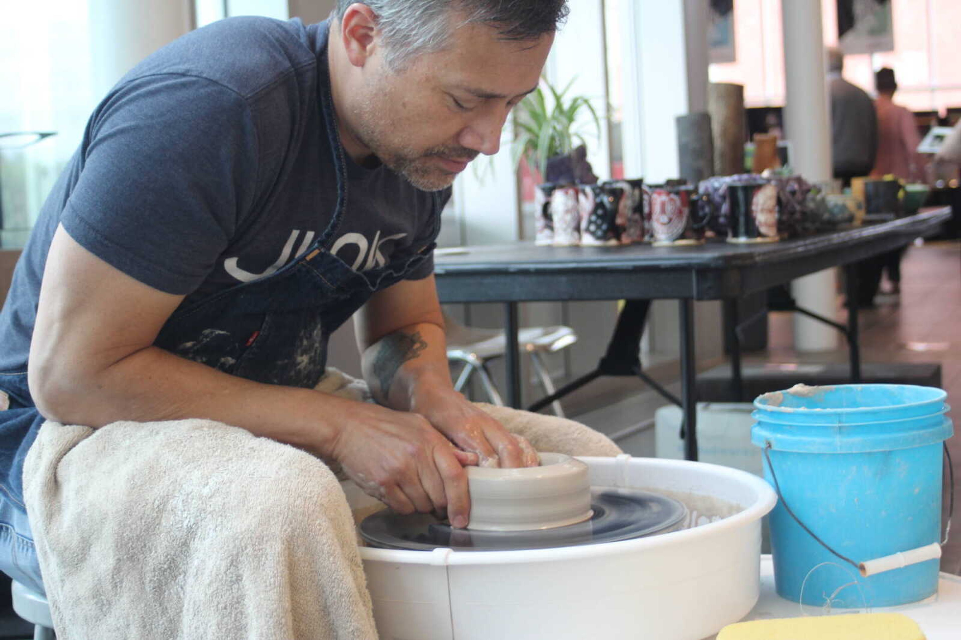 Professor of Art and Ceramics Benji Heu spins a ceramic vase. He said there is not always a financial incentive to pursue arts, but it can be rewarding anyway. “You gotta get a job. Nobody can do things just for fun!”