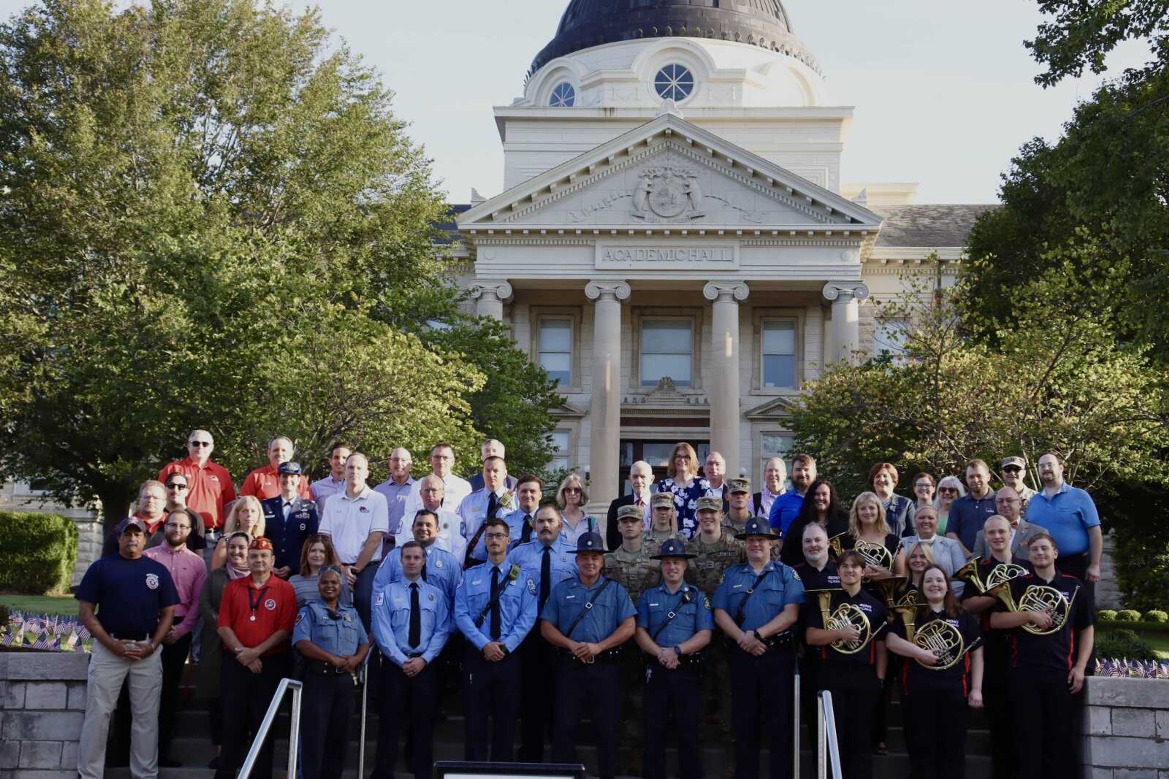 Cape Girardeau service members, first responders, ROTC Air Force and University Staff gather the morning of 9/11 in front of Academic Hall at Southeast Missouri State University.