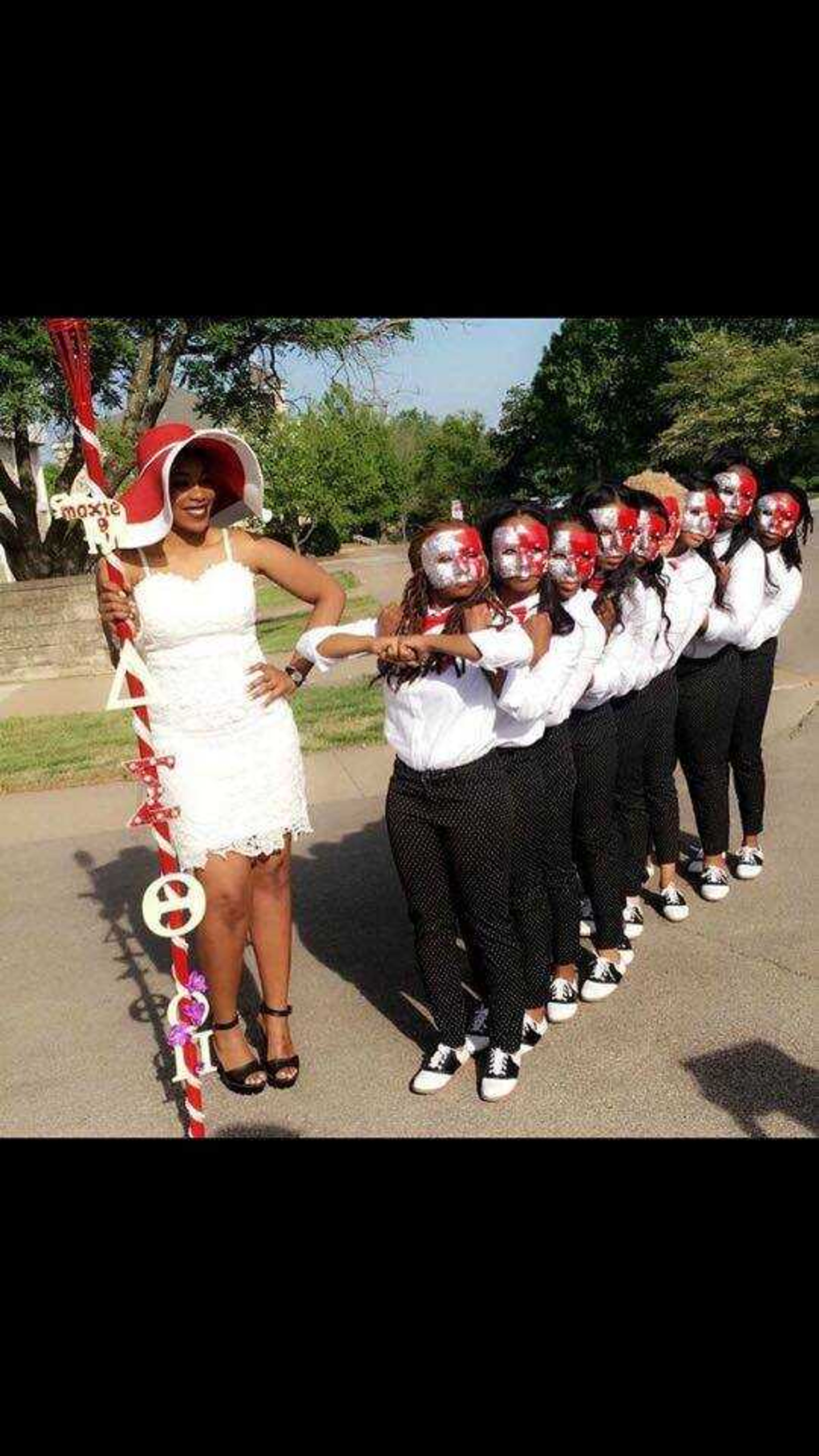 Delta Sigma Theta Sorority Inc.'s president, Kamille Pressley, stands alongside the new members of the Omicron Pi Chapter.