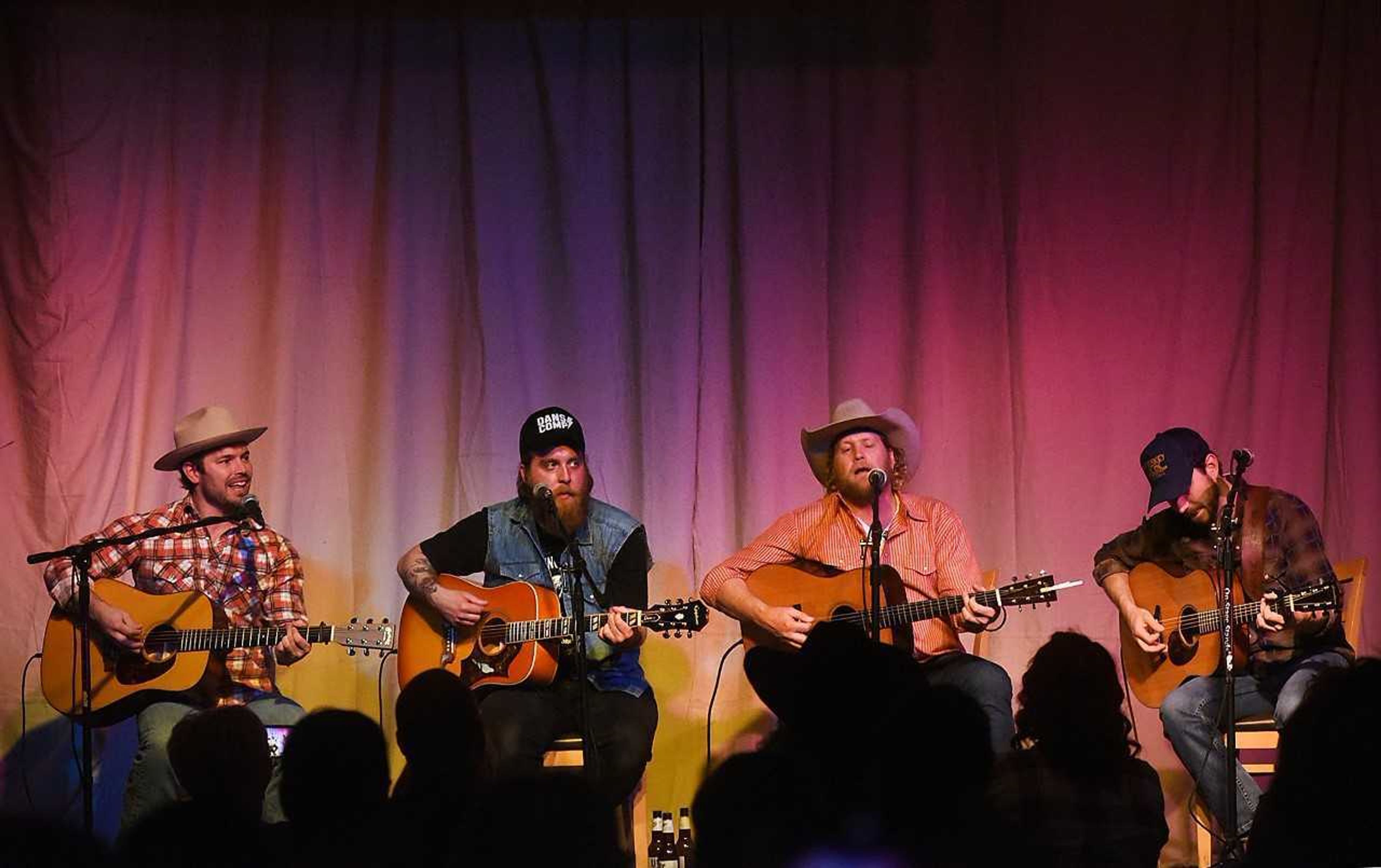 Songwriters from right to left, Adam Hellman, Kasey Lee Rodgers, John D. Hale and Evan Webb, at Sit Down and Shut Up (A Night of Songs) at Port Cape Yacht Club.