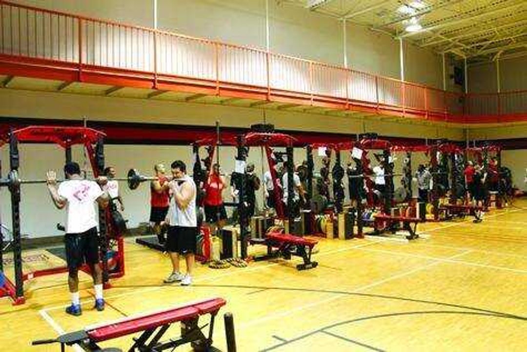 Members of the Southeast football team lift weights in the Student Recreation Center-South on Monday. Photo by Drew Yount