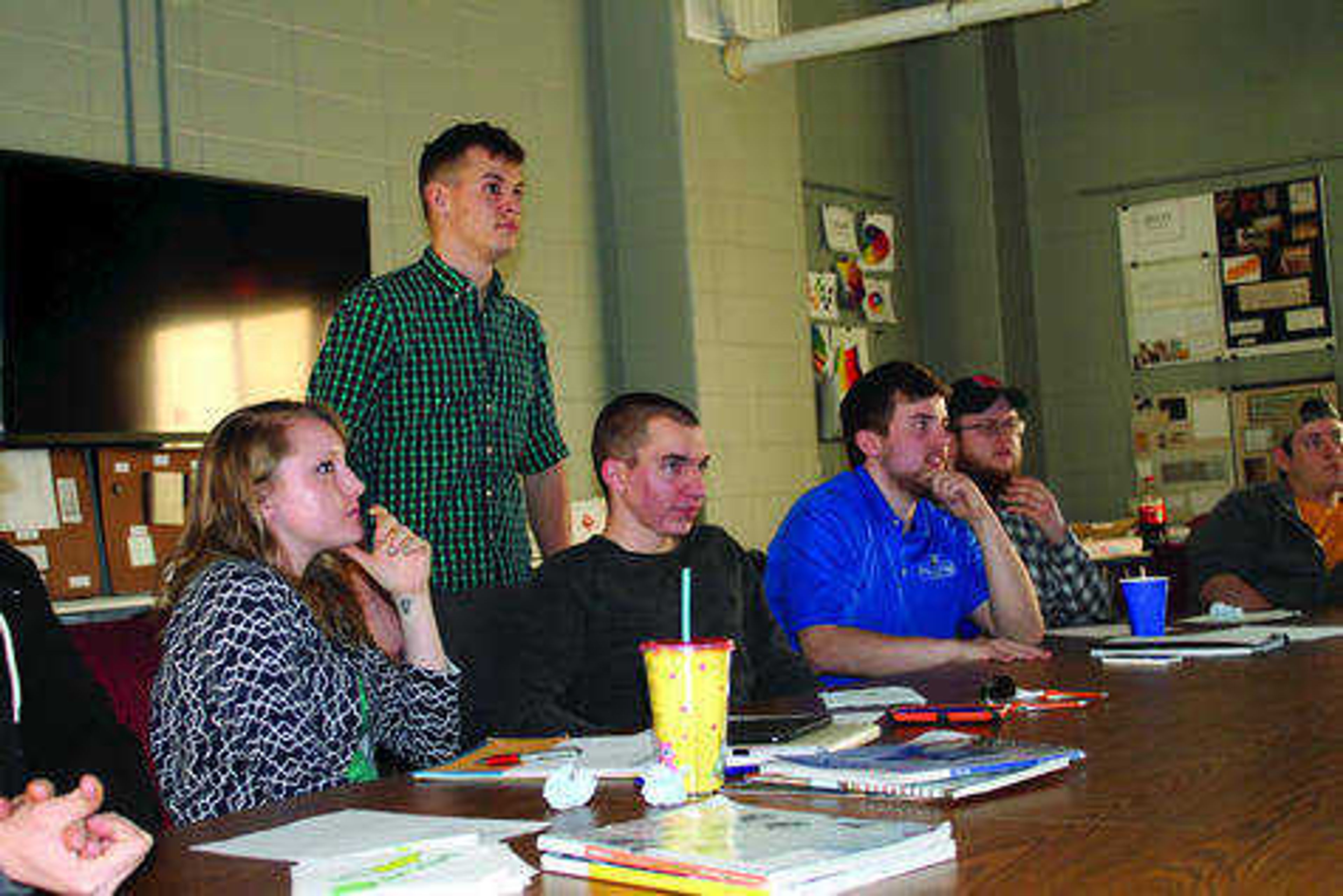 Southeast students (left to right) Elaina Mensinger, Tucker Clements, Michael Oldani, James Grosch and Ian Walker listen in on a meeting for the Sustainable Student Organization. Photo by Karley McDaniel