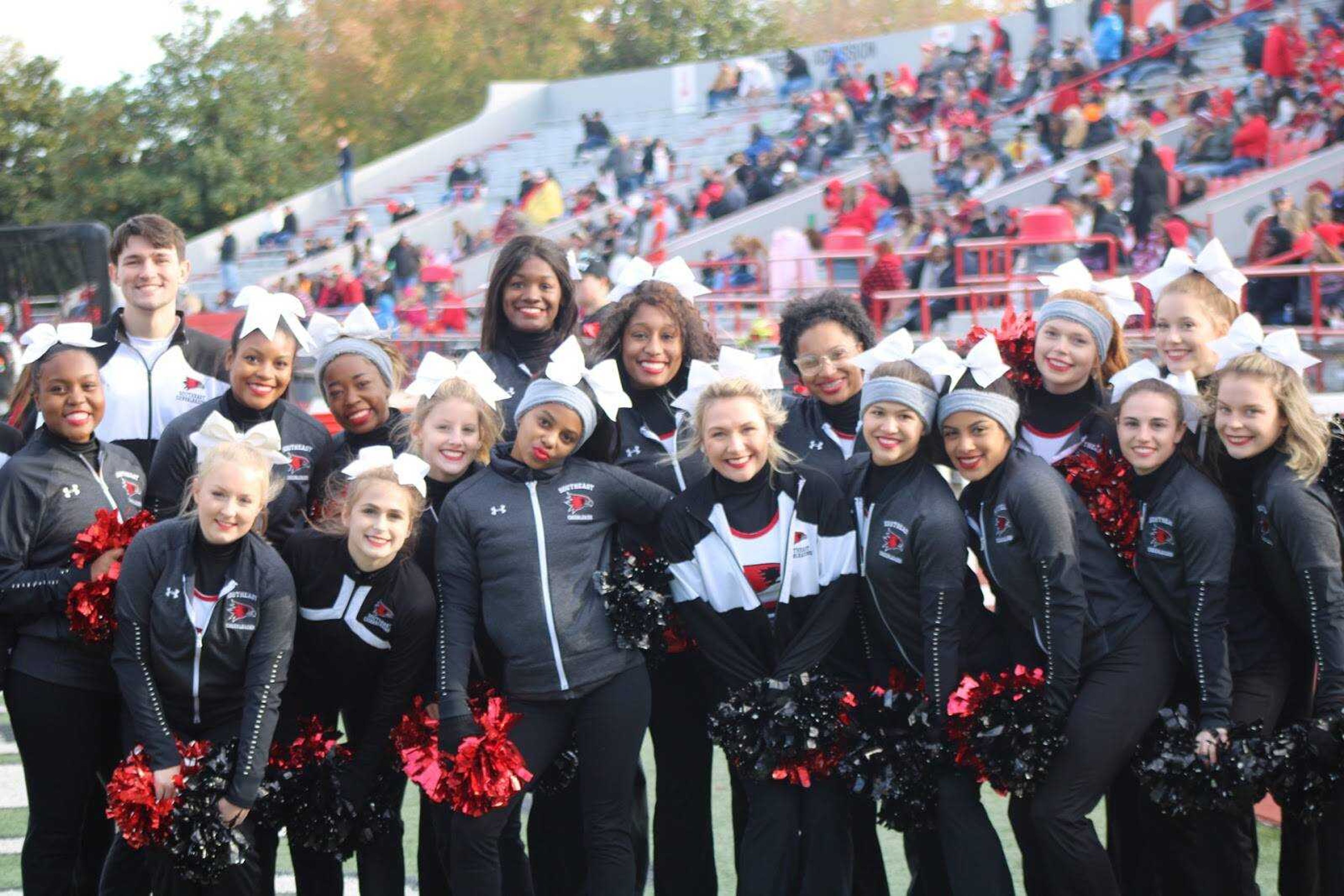 The Southeast cheerleading team poses during a football game on Nov. 8 at Houck Stadium.