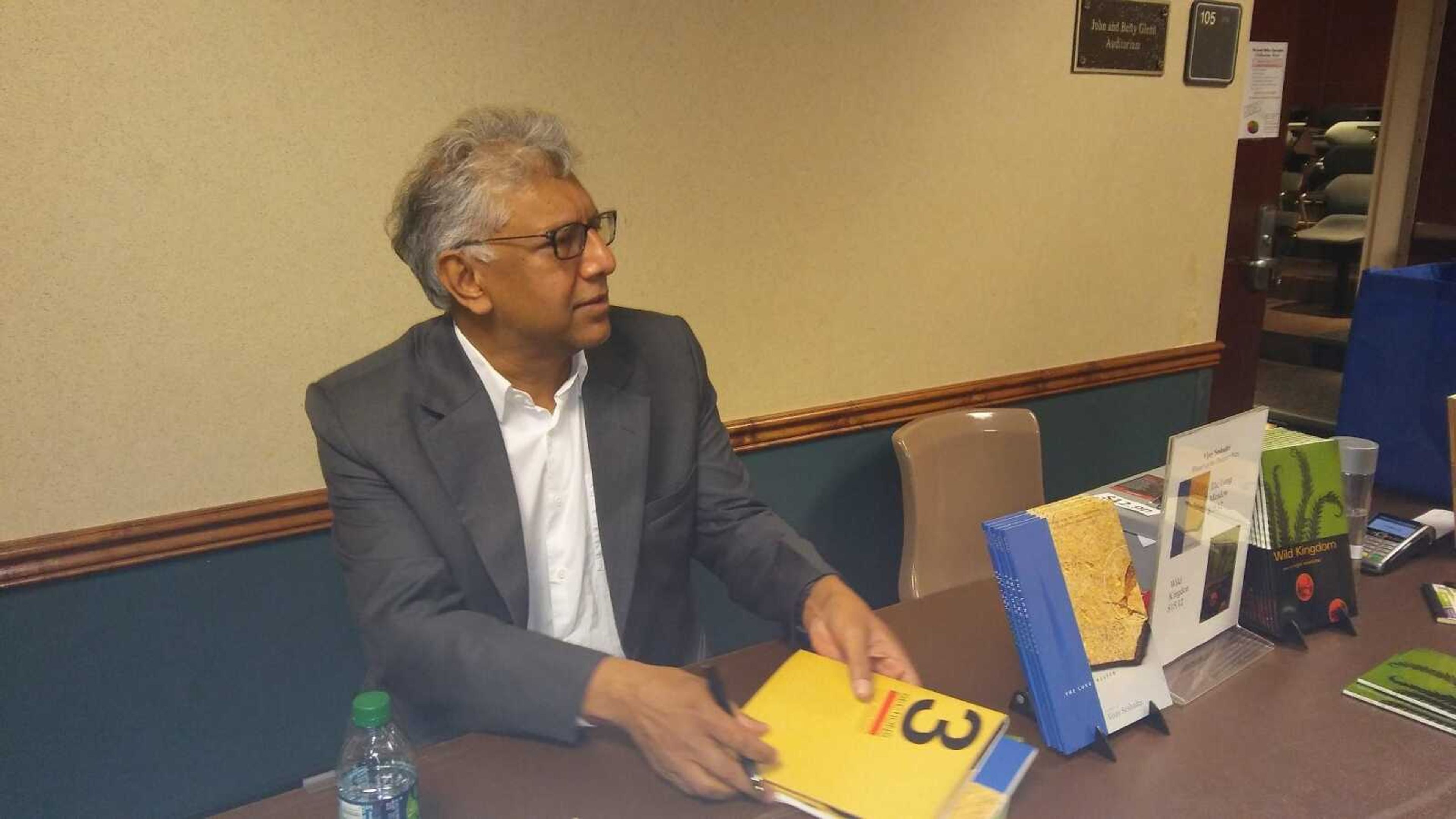 Vijay Seshardi, a Pulitzer Prize-winning poet, signs copies of his books for students who came to see him speak on Sept. 29.