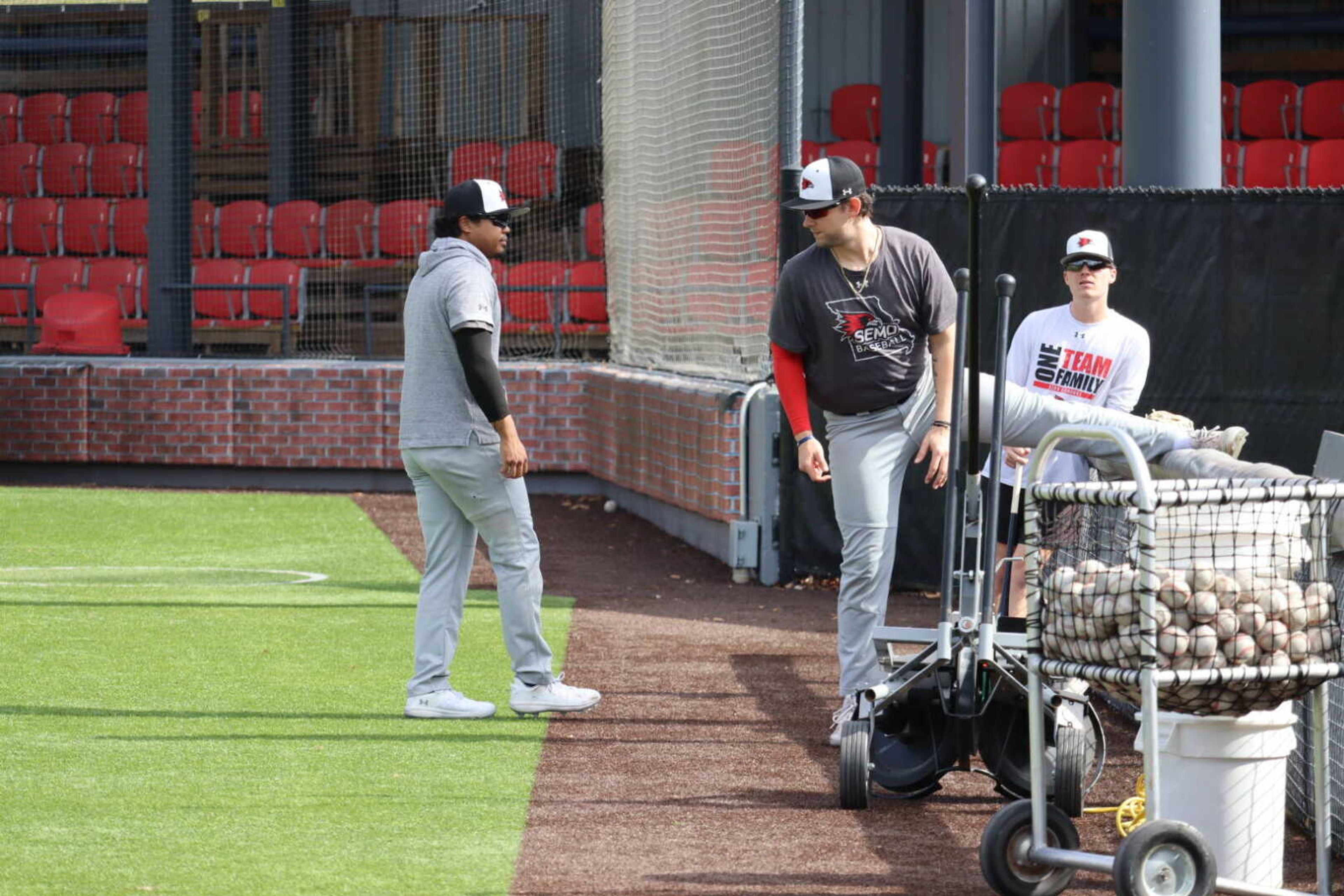 Senior outfielder Jevon Mason talks with teammates before practice. Mason was tied for second on the Redhawks last year in hits with 73 and third in home runs with 14.
