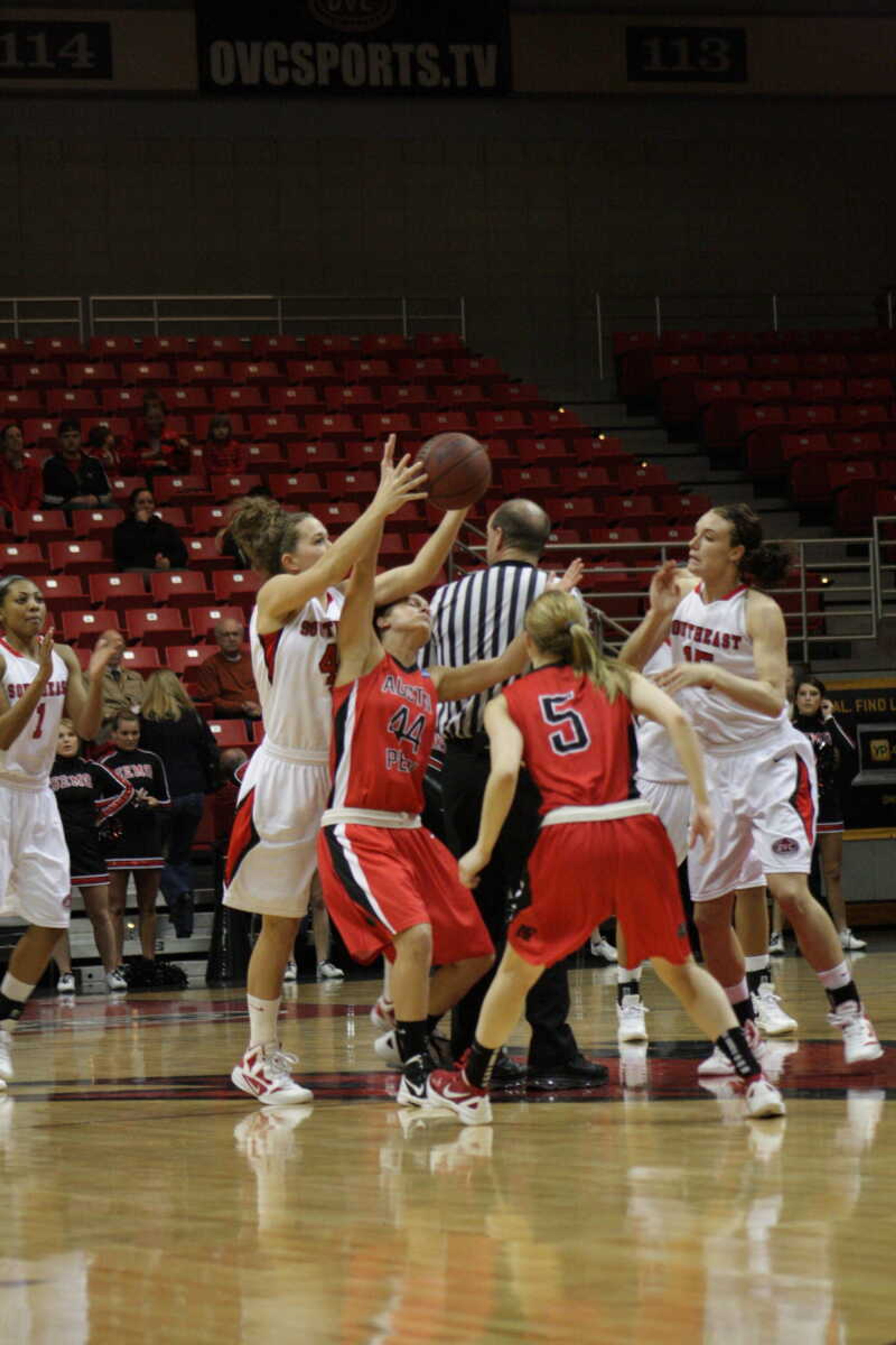 Southeast forward Bailie Roberts fights for possession of the basketball with Austin Peay guard Shelby Olszewski (44) in the first half on Monday night's game. Southeast won 69-60. - Photo by Nathan Hamilton