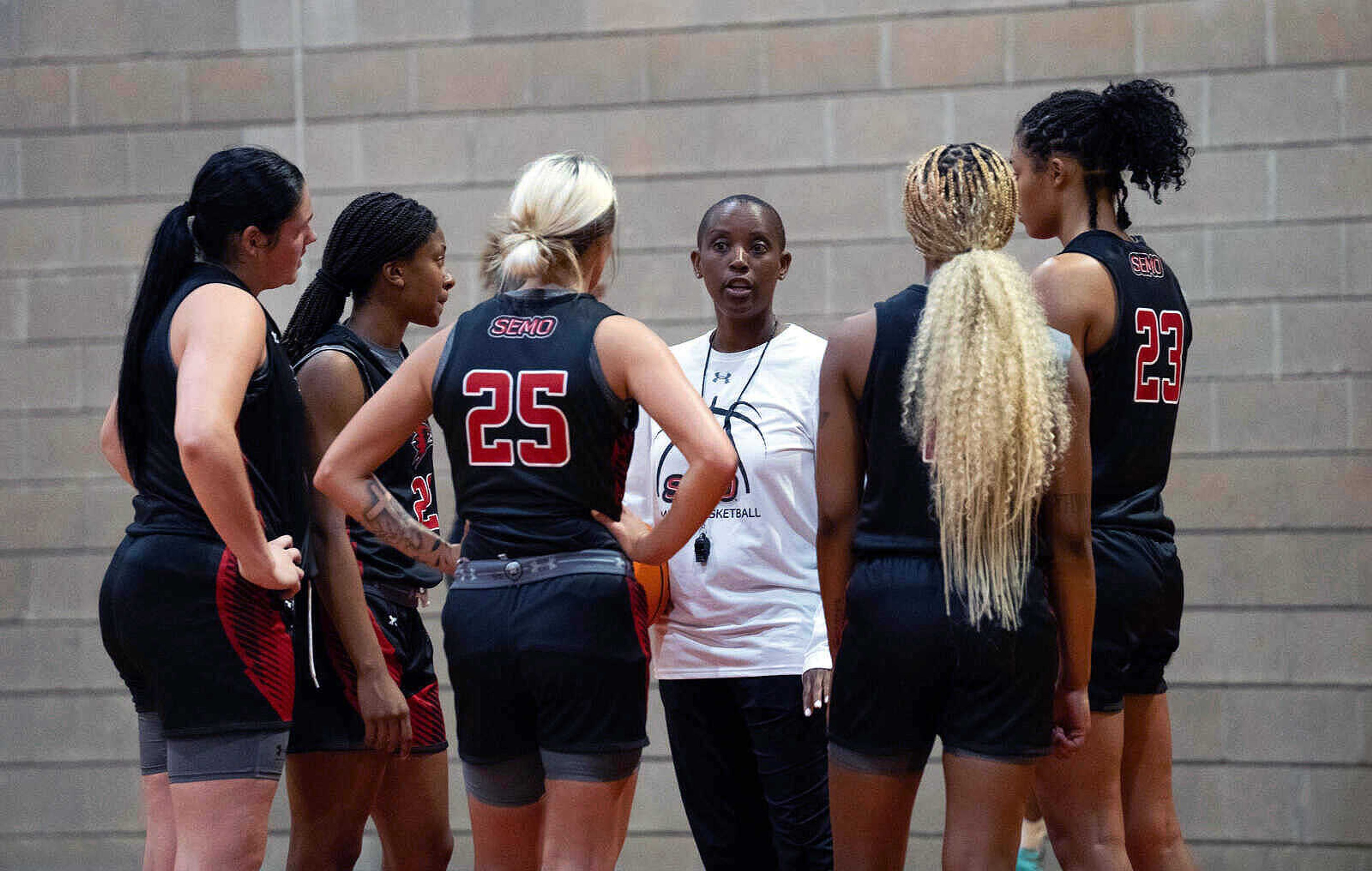 Women's basketball Coach Patterson working with her team during opening practice for the 2023 season.