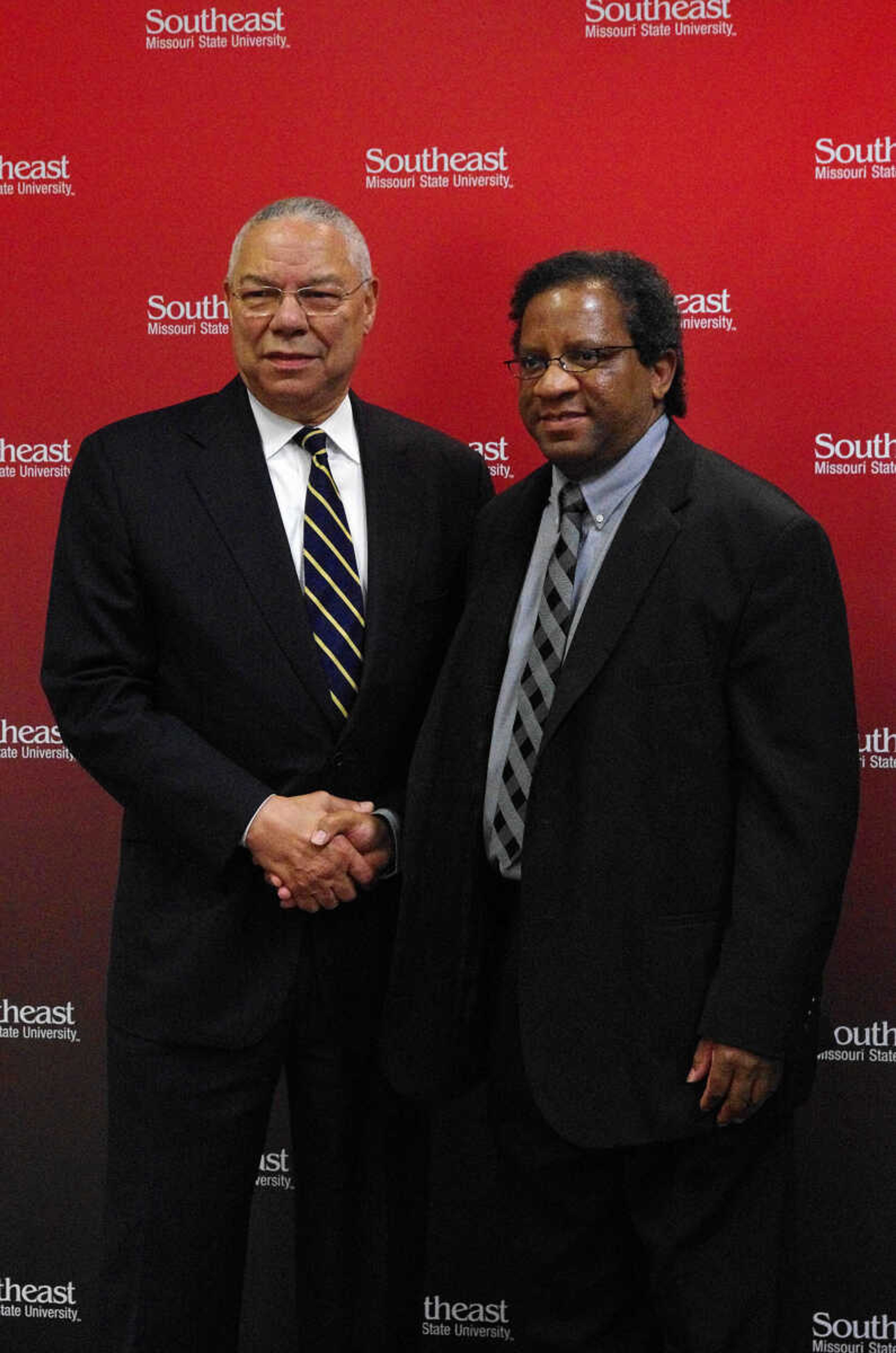 Gen. Colin L. Powell, left, Dr. Willie Redmond, right, shake hands. Dr. Redmond is a professor in the Department of Economics and Finance. Photo by Nathan Hamilton.