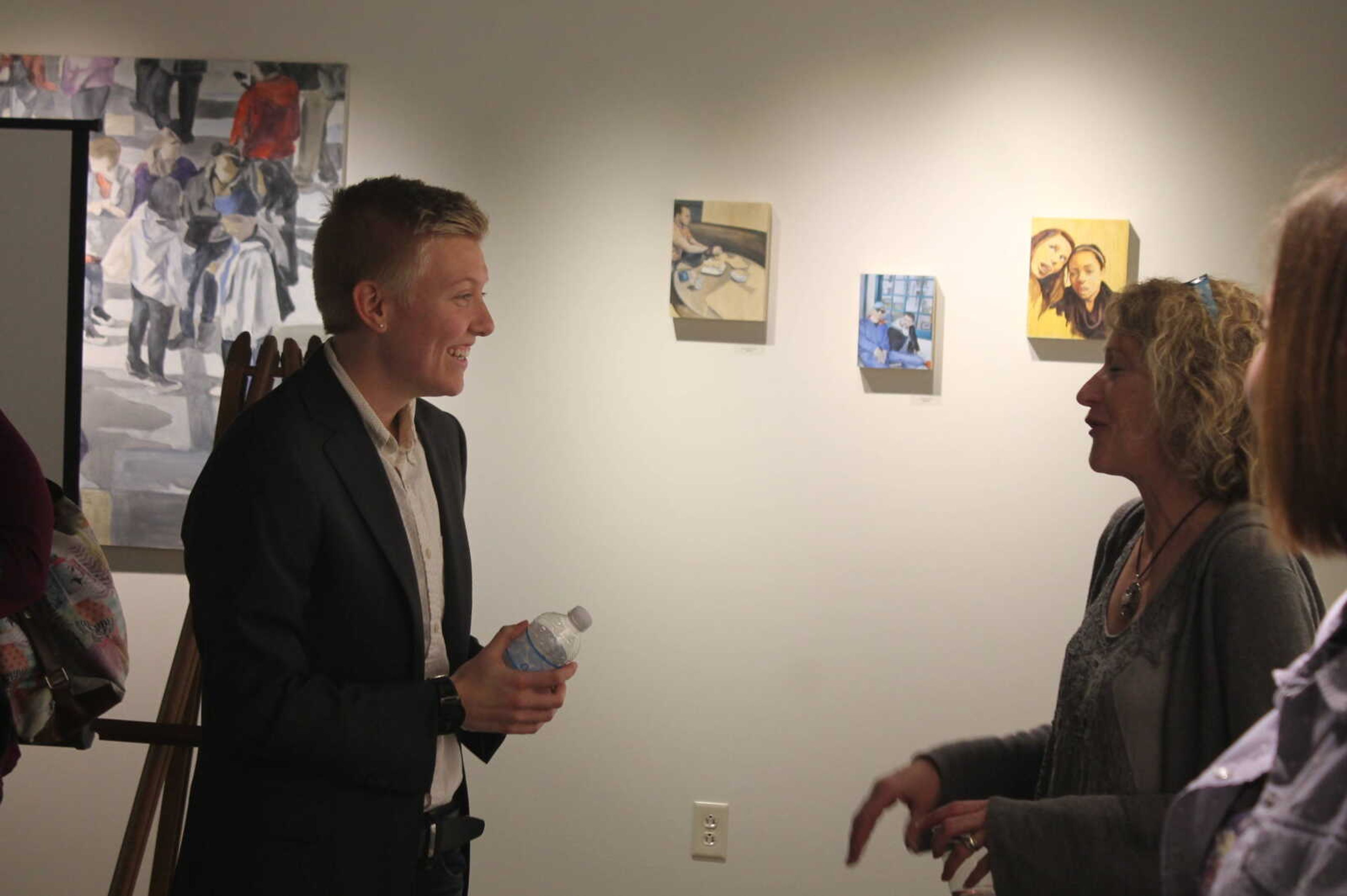 Rane Belling talking with audience members after the "Breaking the Binary" event.