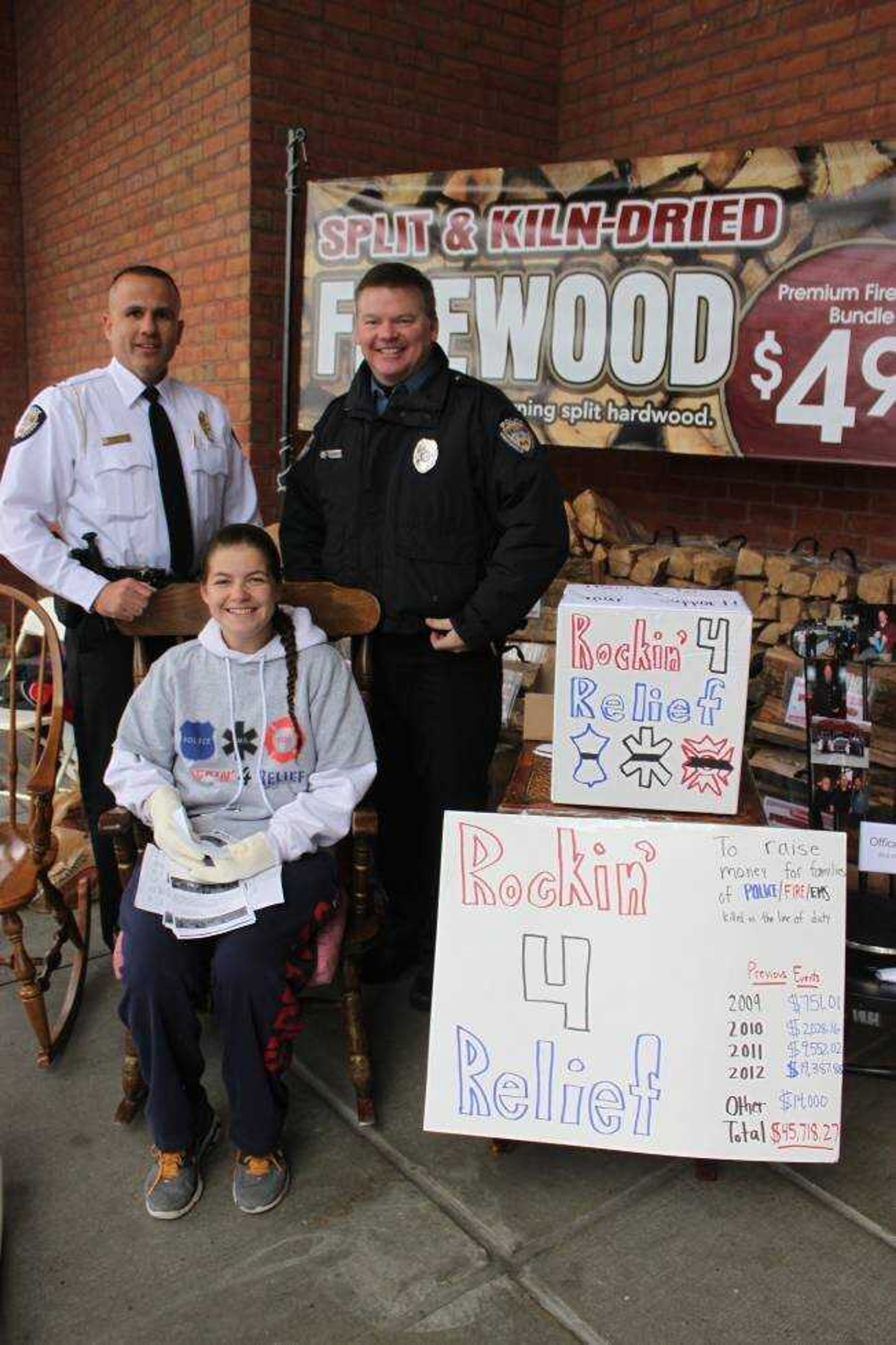 Jennifer Rubin, founder of Rockin 4 Relief, poses for a photo with two cops.