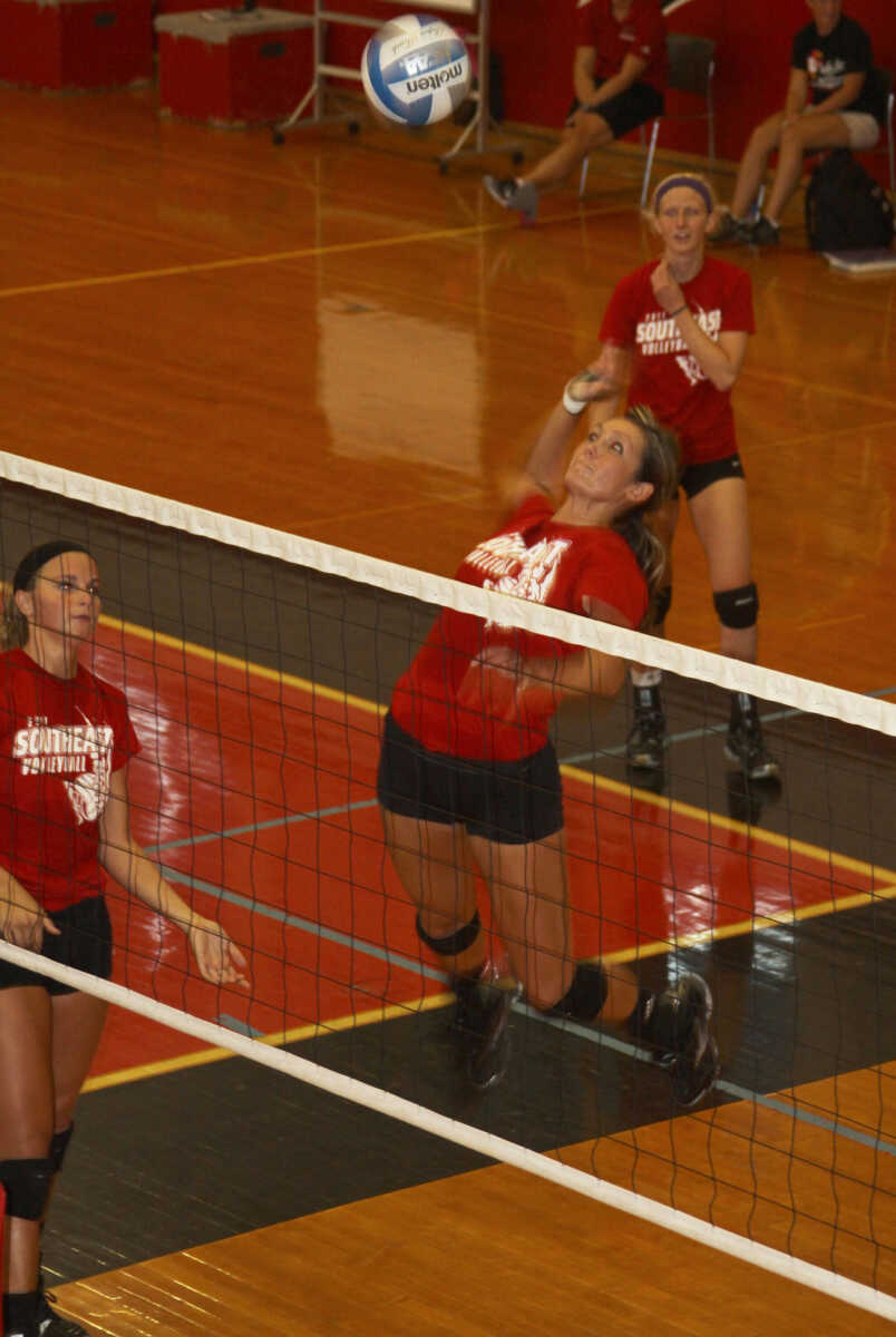 Outside hitter Paige Dossey comes up for a ferocious spike. - Photo by Kelso Hope
