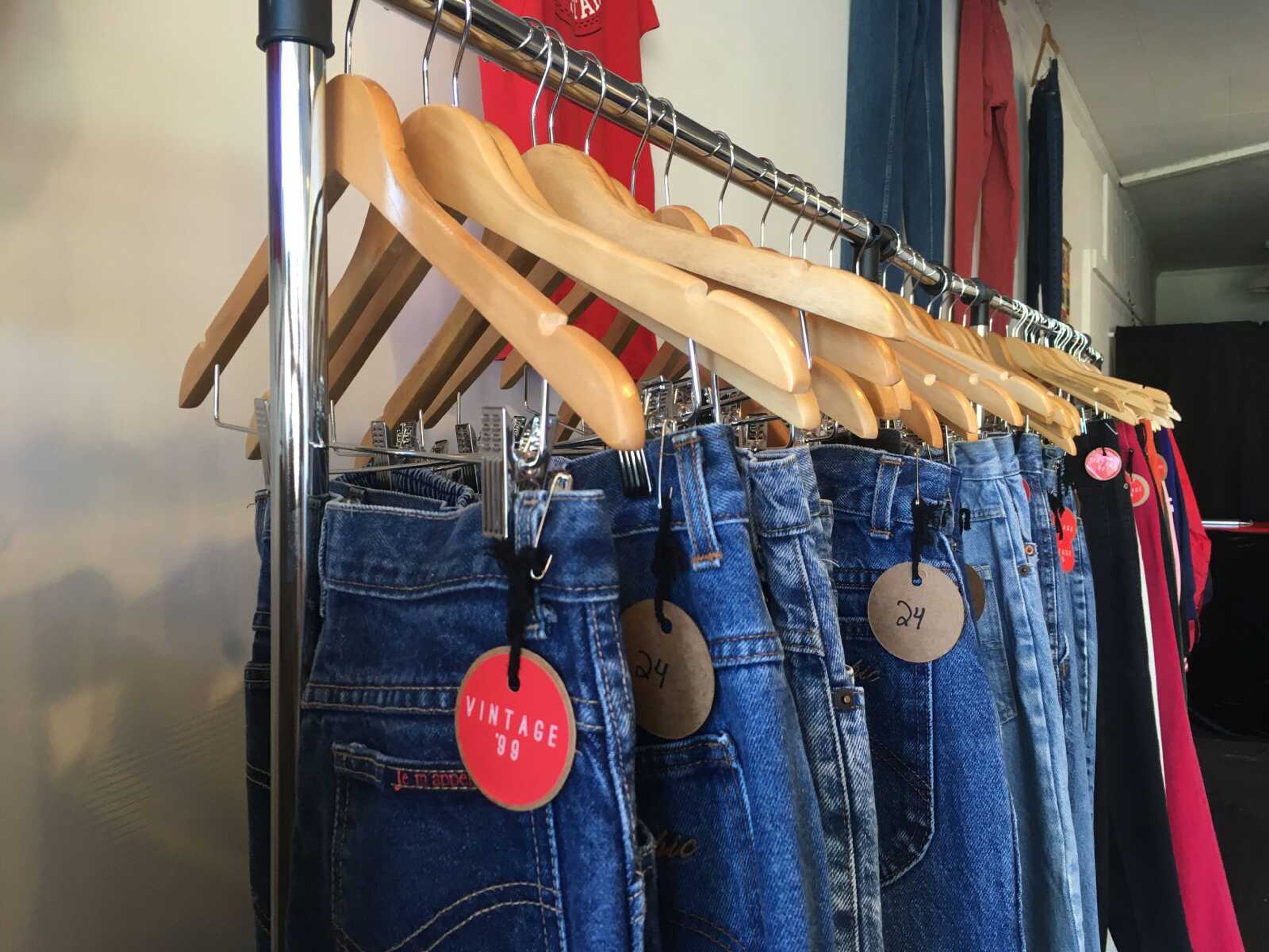 A clothing rack at Vintage '99 displays the store's denim collection, which is sourced secondhand from sellers across the country.