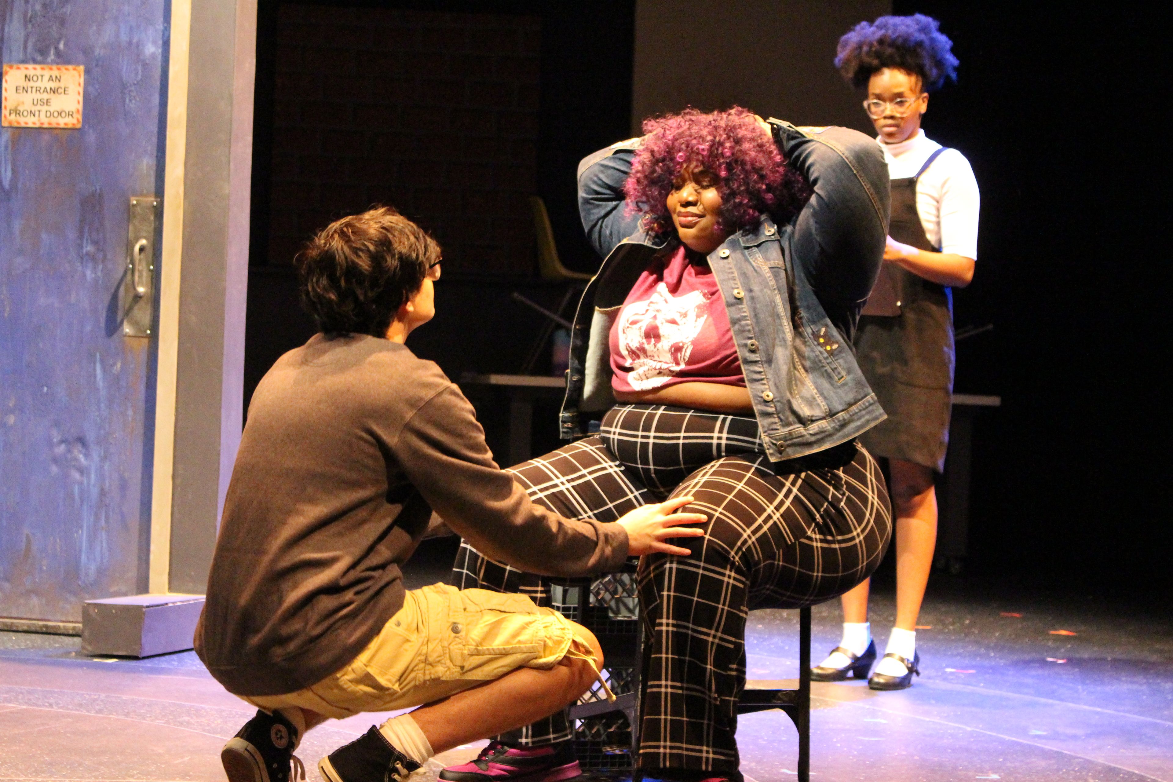 Characters Anton and DJ hang outside of the theater as Becky watches from another perspective in Our Play.