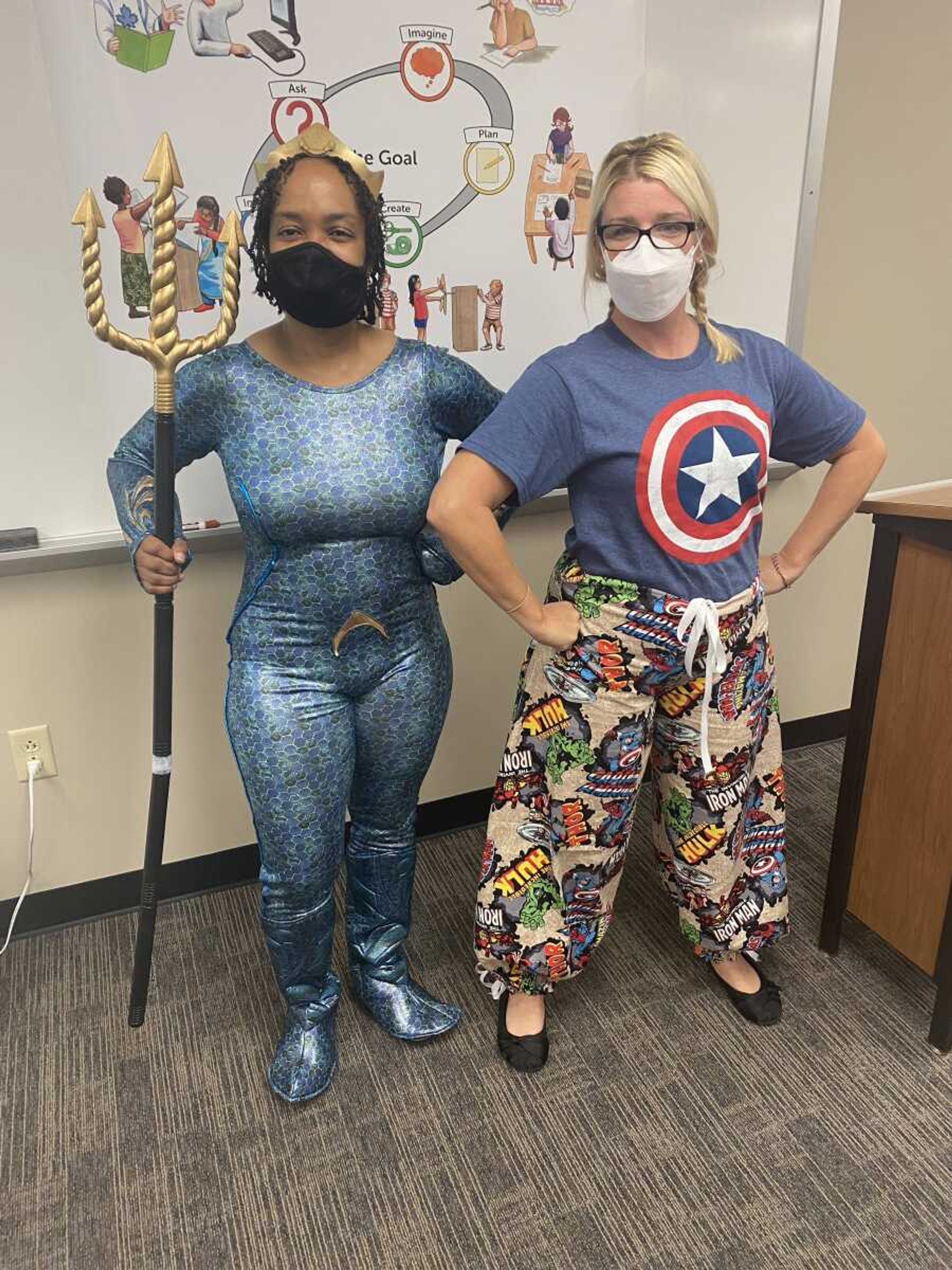 Dr. Shonta Smith (left) dressed up as Aqua-man and Dr. Brandy Hepler (right) dressed in the pants she created. 