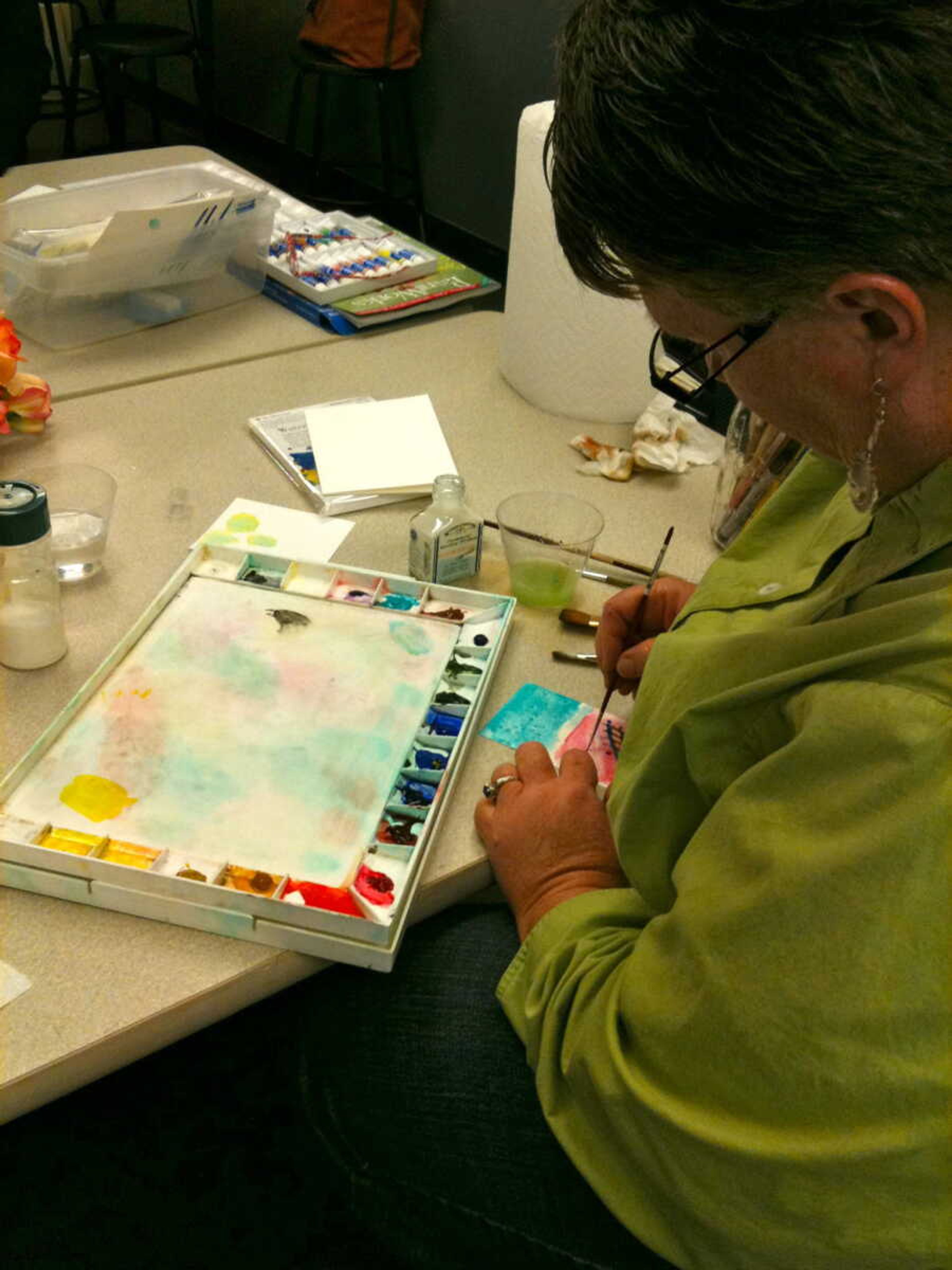 <b>Participants in the 2012 Adult Art Workshops work on watercoloring.</b> Submitted photo