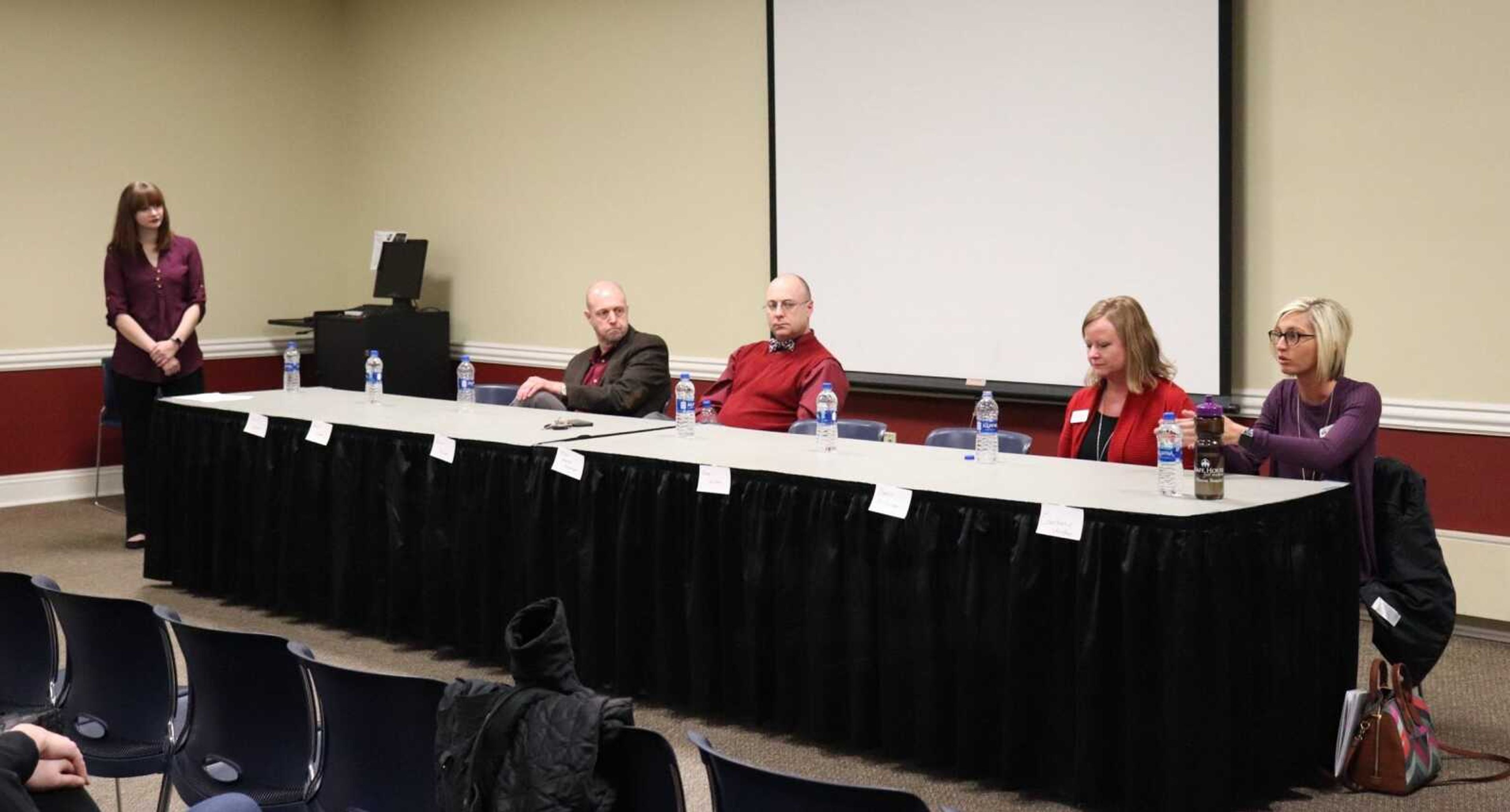 Jessica Strunk (far left) moderates the sexual assault panel on Monday in the university center. From left to right, the panelists are Randy Carter, Bruce Skinner, Donna St. Sauver, and Courtanie Vaughn.