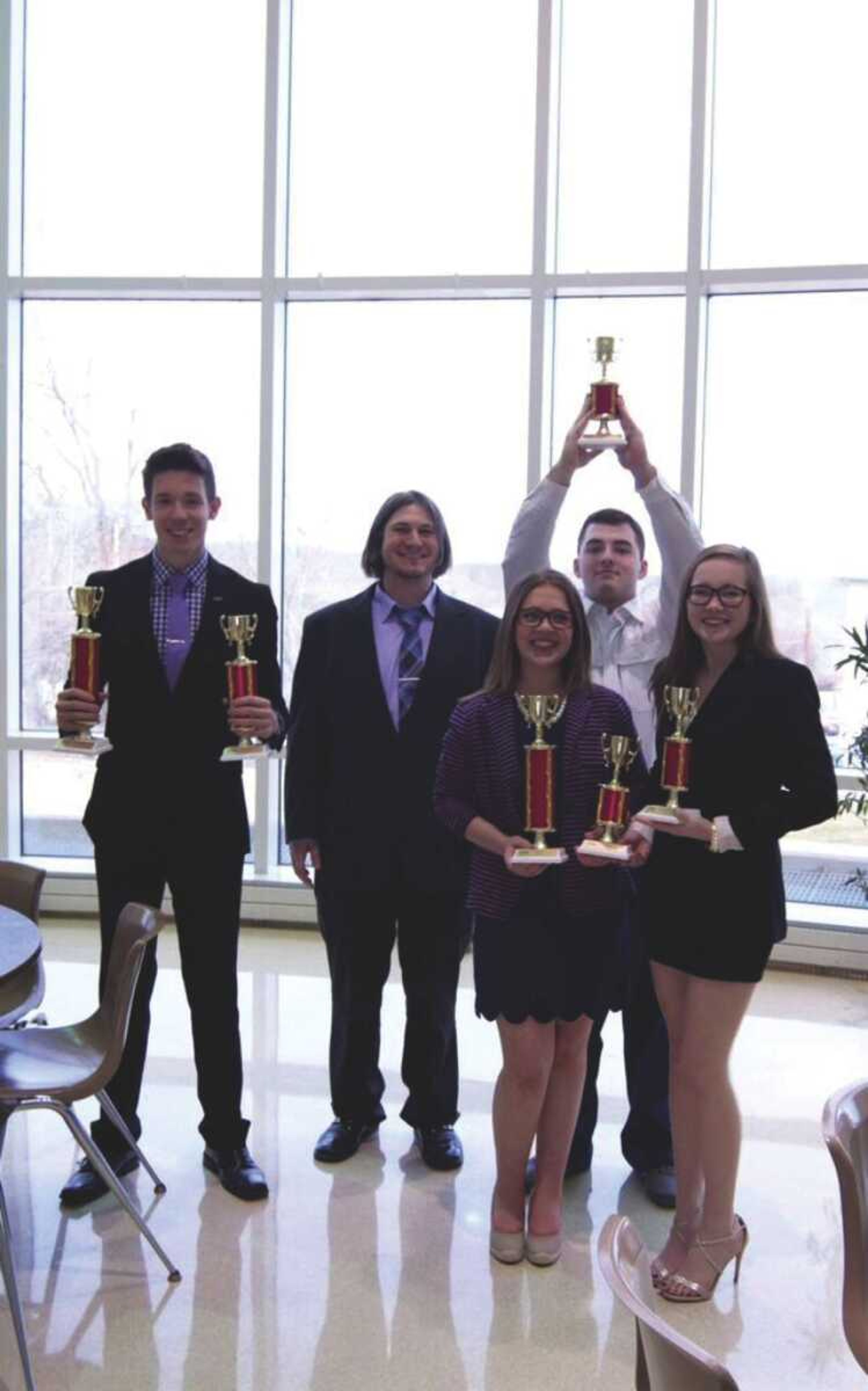 Debate coach Dr. Avery Henry (second from the left) and debate team members after the Redhawk Rumble debate tournament Feb. 13.