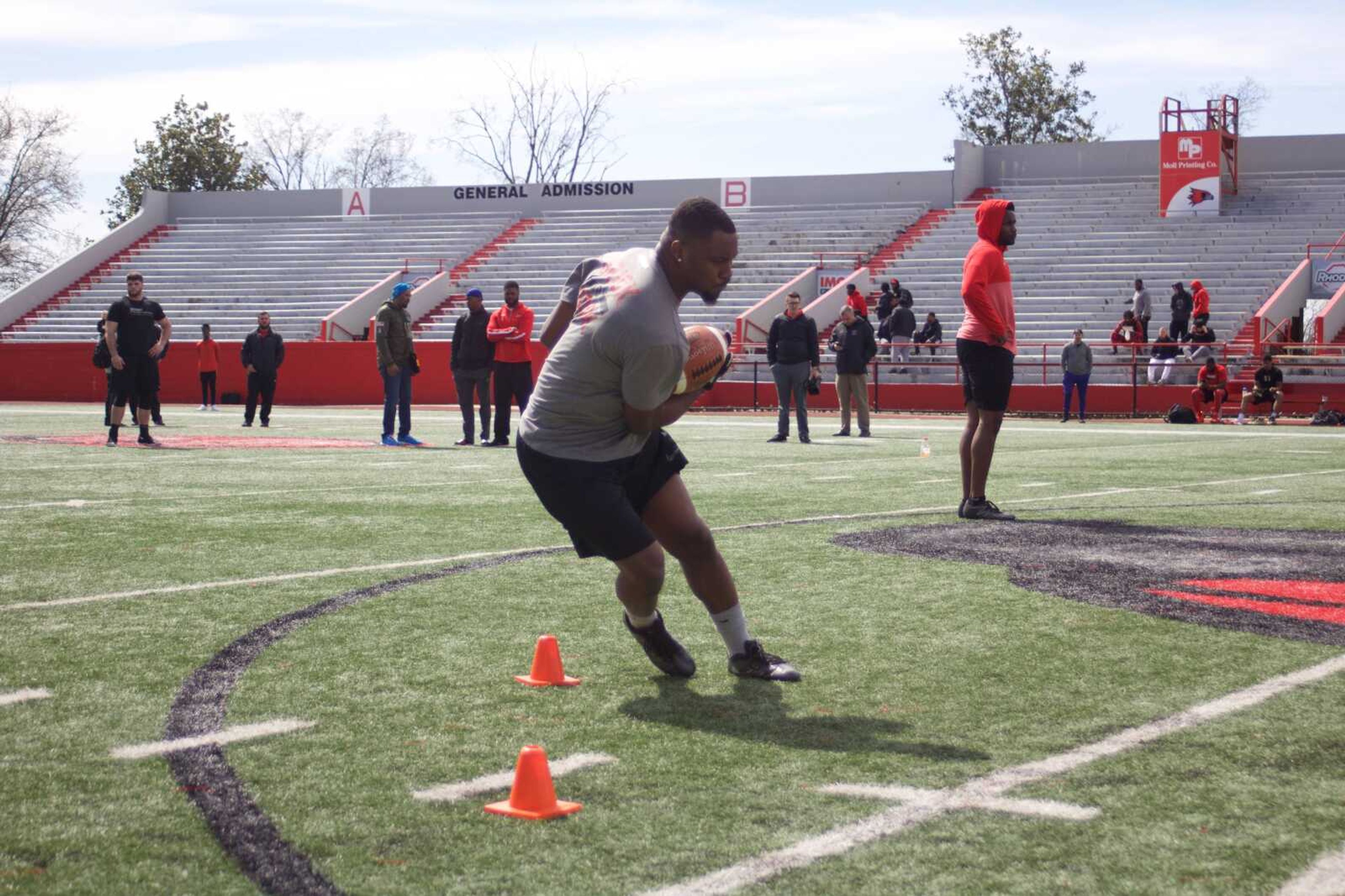 Senior running back Marquis Terry cuts between cones during a position drill at Southeast's pro day on March 26.