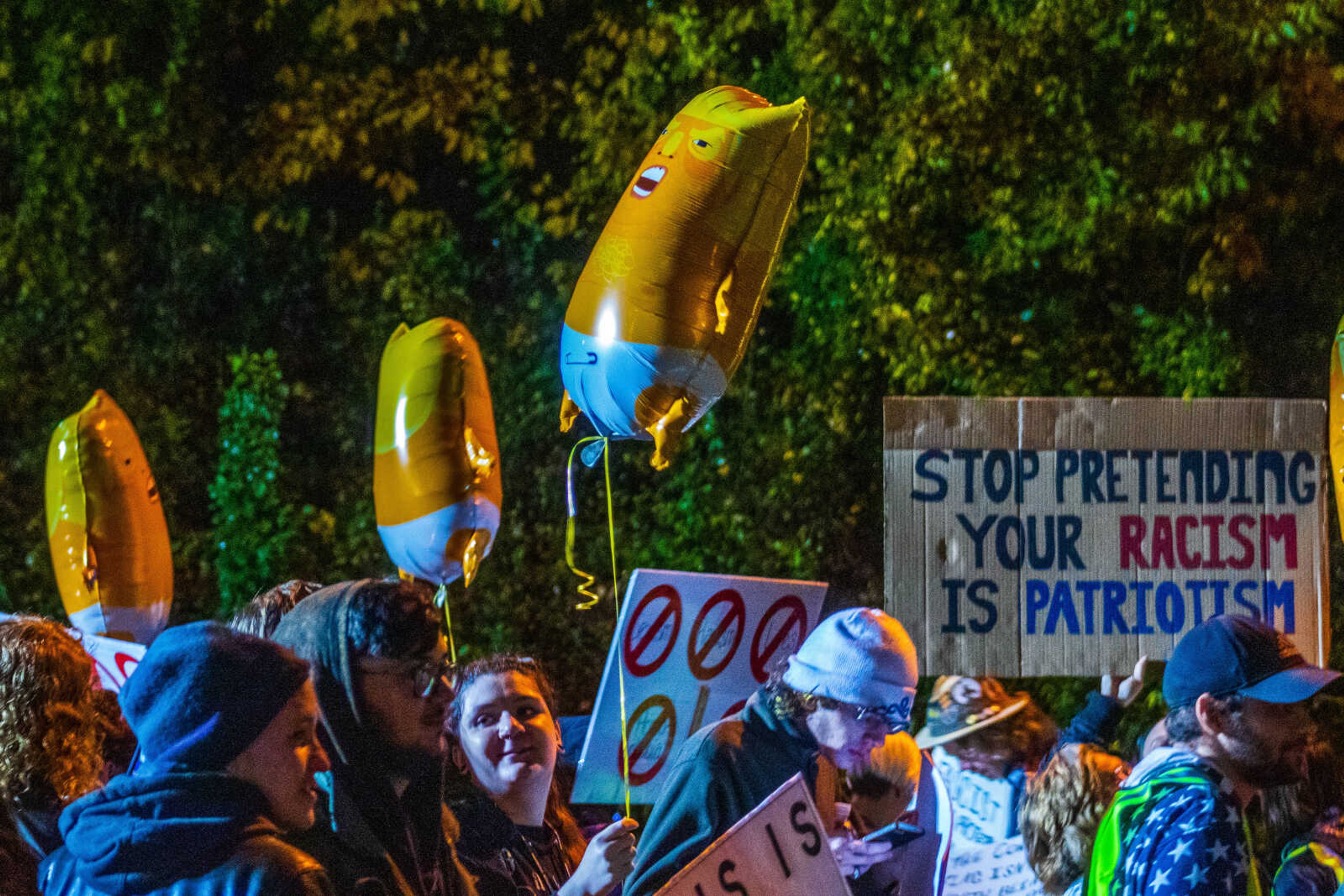 Anti-Trump protesters gathered outside the Show Me Center of Nov. 5 were given several "baby Trump" balloons to hold.