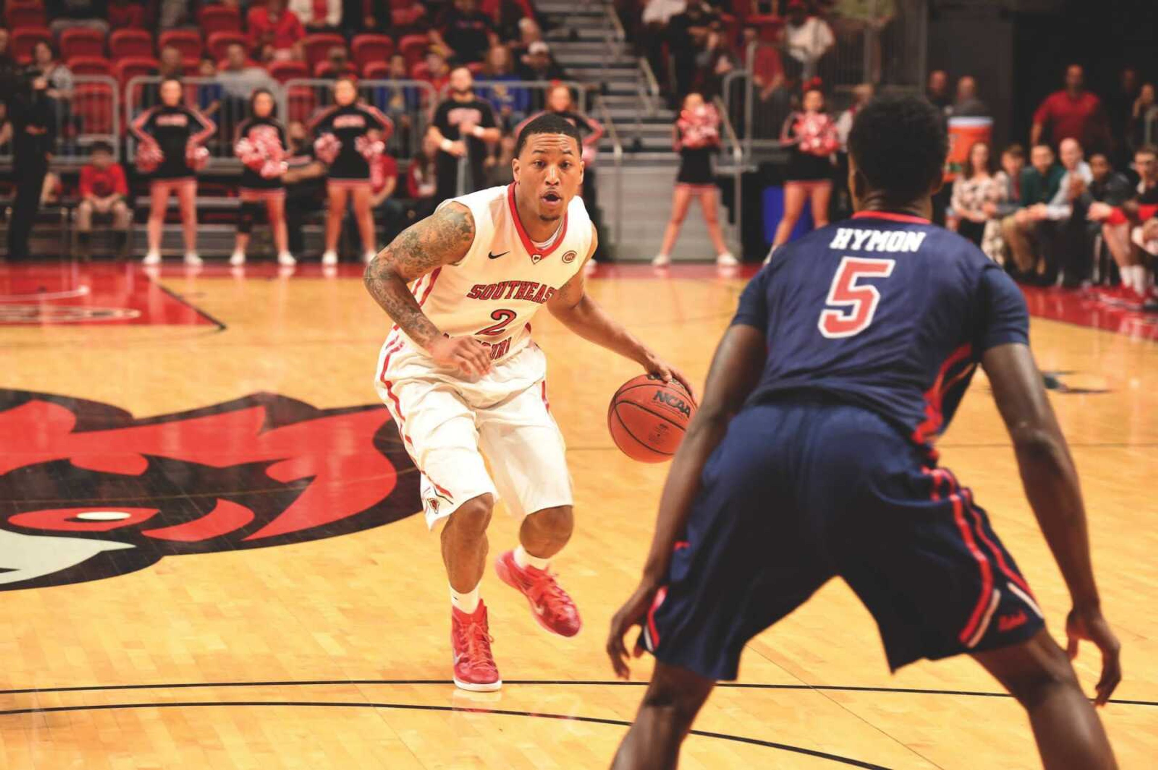 Senior guard Isiah Jones dribbles toward a defender in the Redhawks' game against Ole Miss.