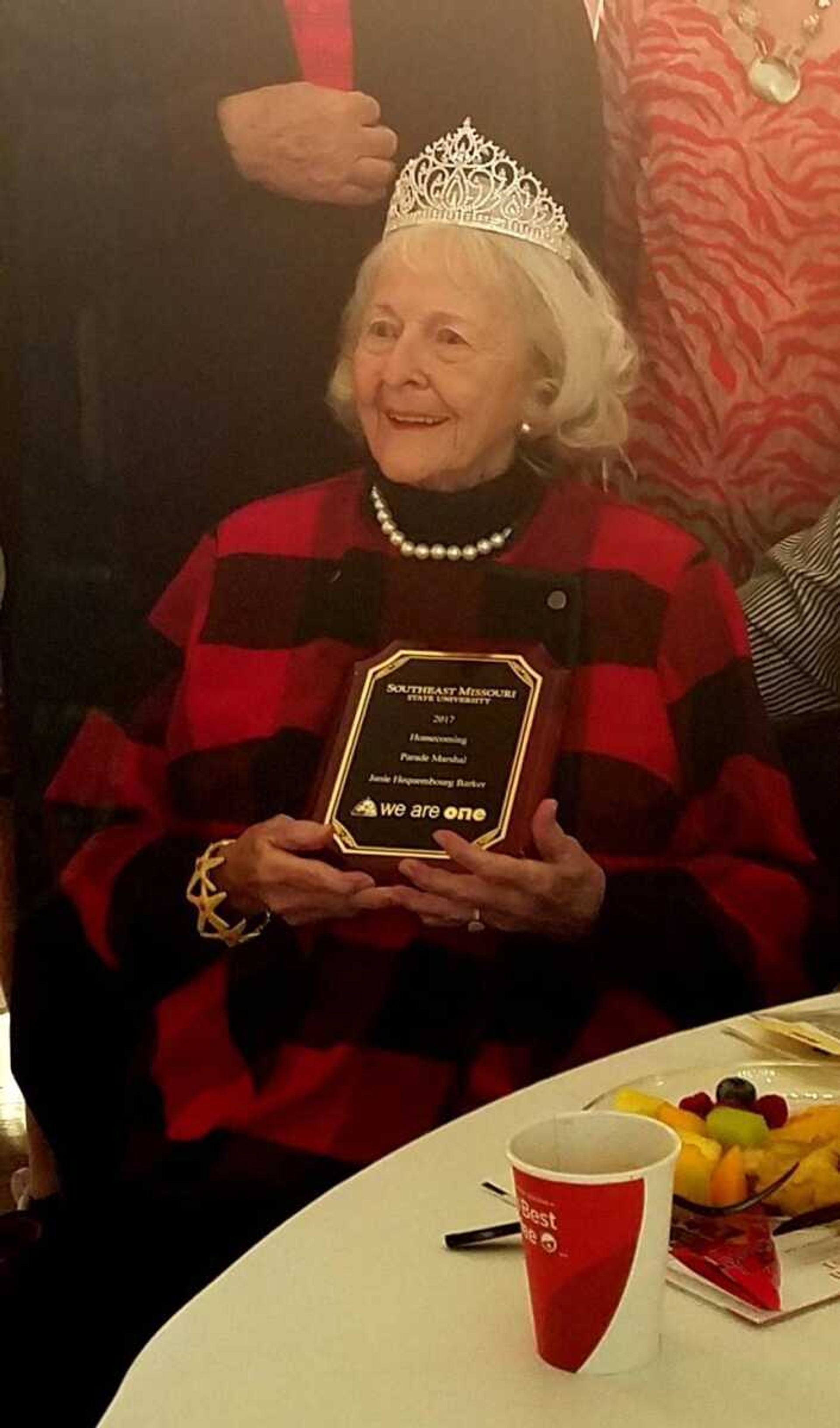Barker poses for a picture following Saturday’s ceremony. She was awarded a crown for her original title and a plaque commemorating her role as 2017 Homecoming Parade Marshal.