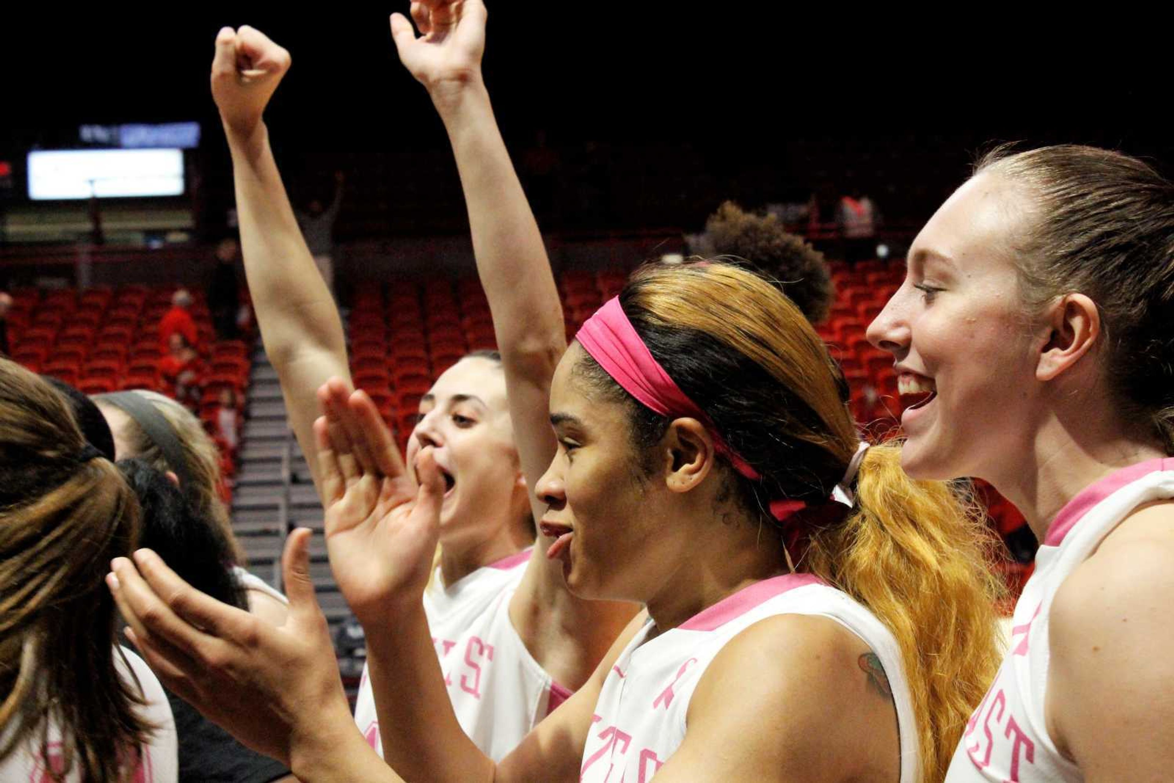 The women's basketball team celebrates their victory over the Eastern Illinois Panthers in the Show Me Center on Feb. 14.