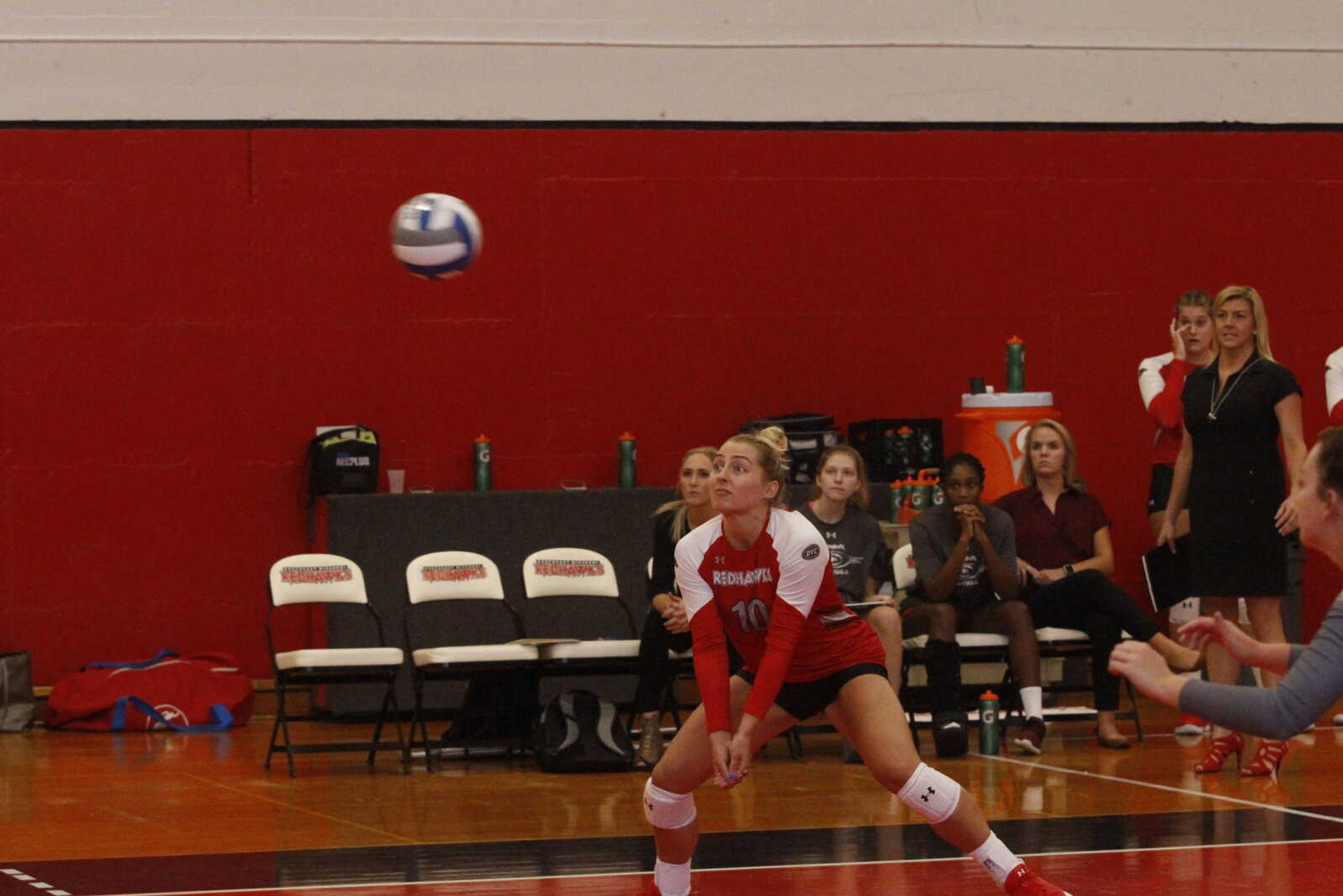 Senior Madeline Grimm bumps the ball back to the opponent's side during the Redhawks Invitational tournament Sept. 1 at Hock Fieldhouse.