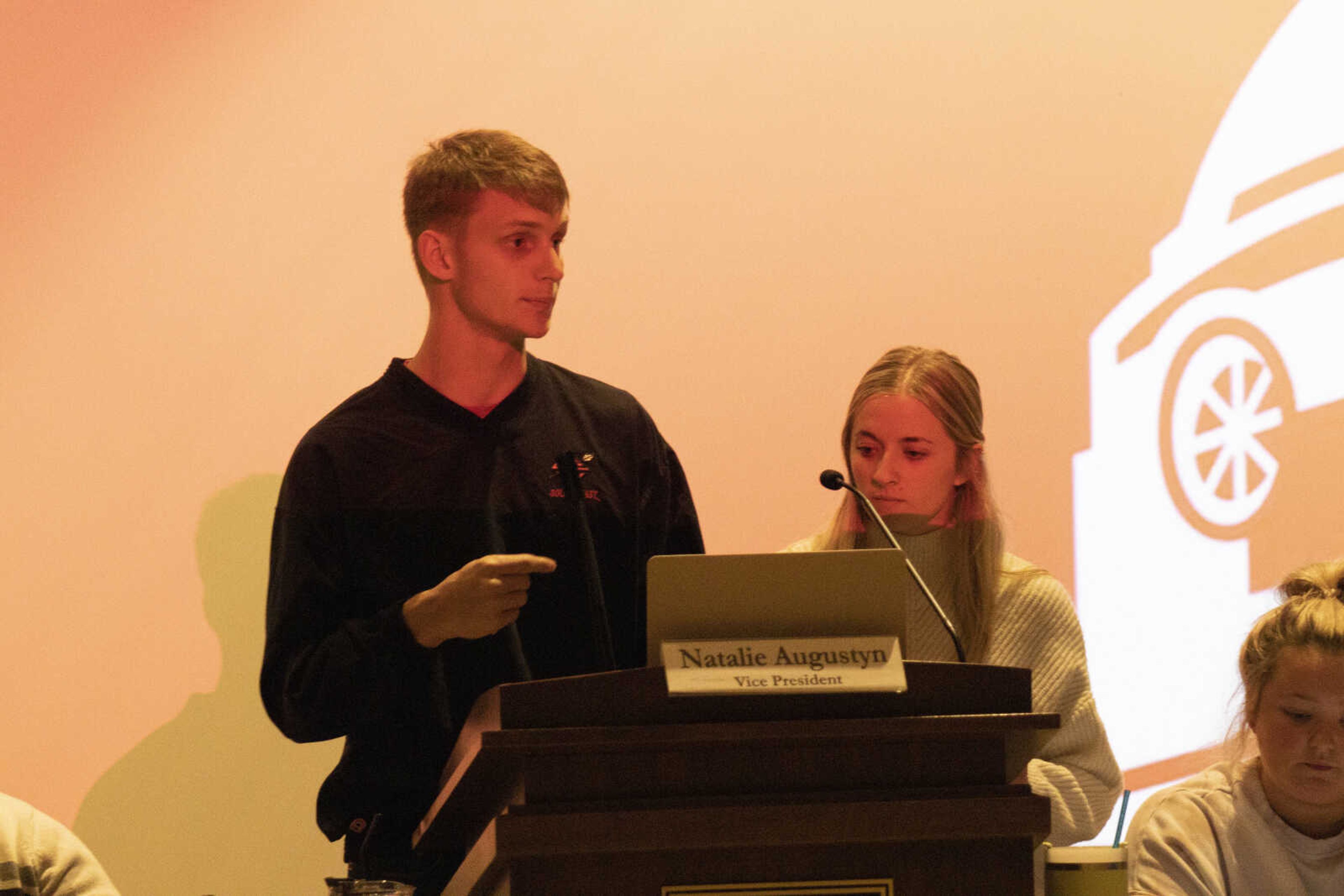 (Left) Campus Movement's Brock Wood and Kaitlyn Pickett presents a funding request to for their New Year's Conference  to SGA senators at the Oct. 31 SGA meeting.