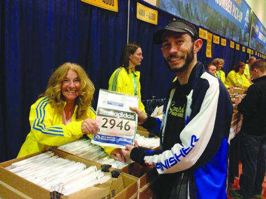 Greg Soutiea picks up his race number for the 117th Boston Marathon.  Submitted photo