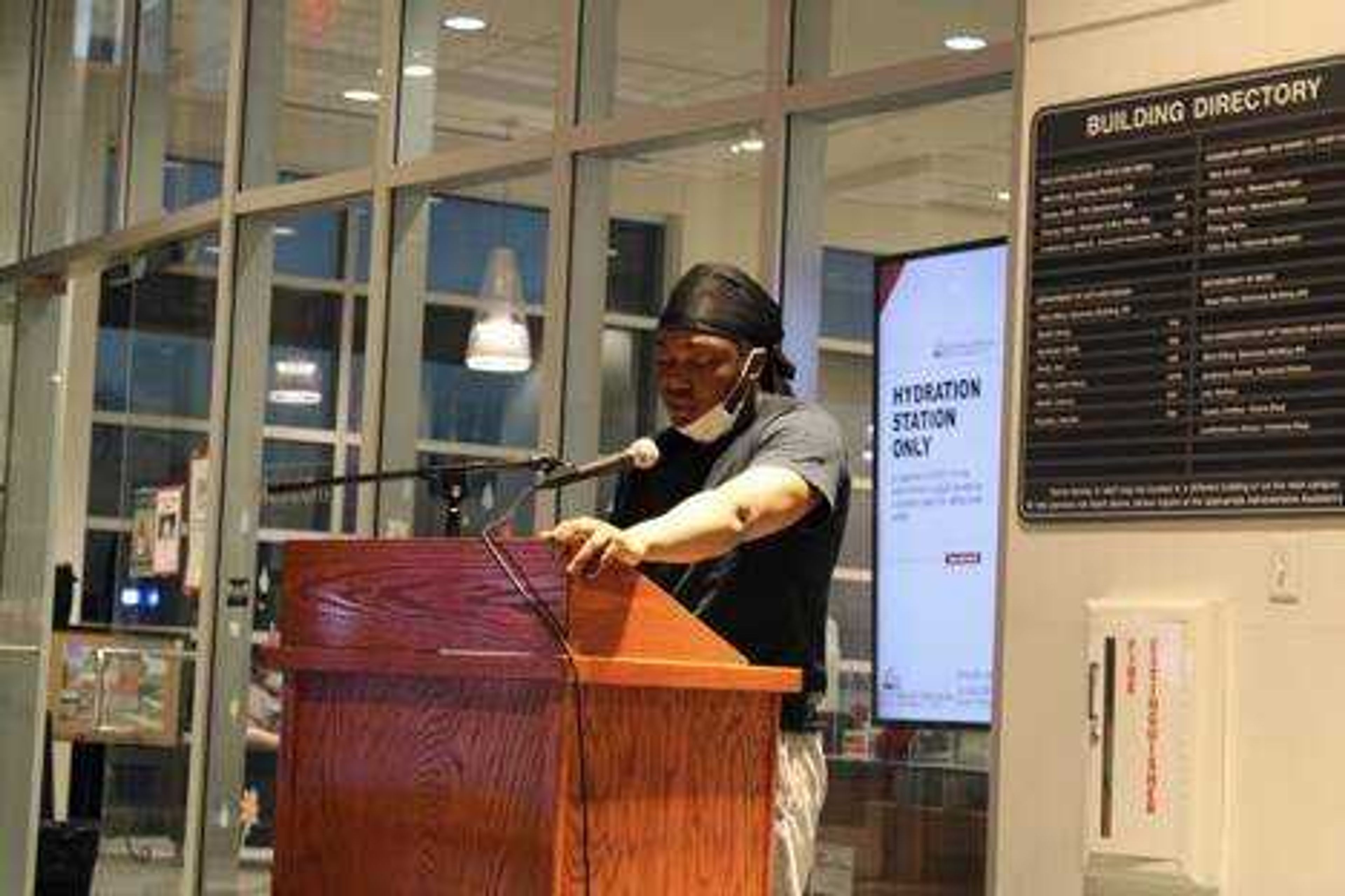 Junior Atum Miles reads “Am I a Monster?” a piece of poetry he wrote about his own life. Miles read this poem for students and community members at the annual Open Mic Poetry Night in the lobby next to the Crisp Museum at River campus.