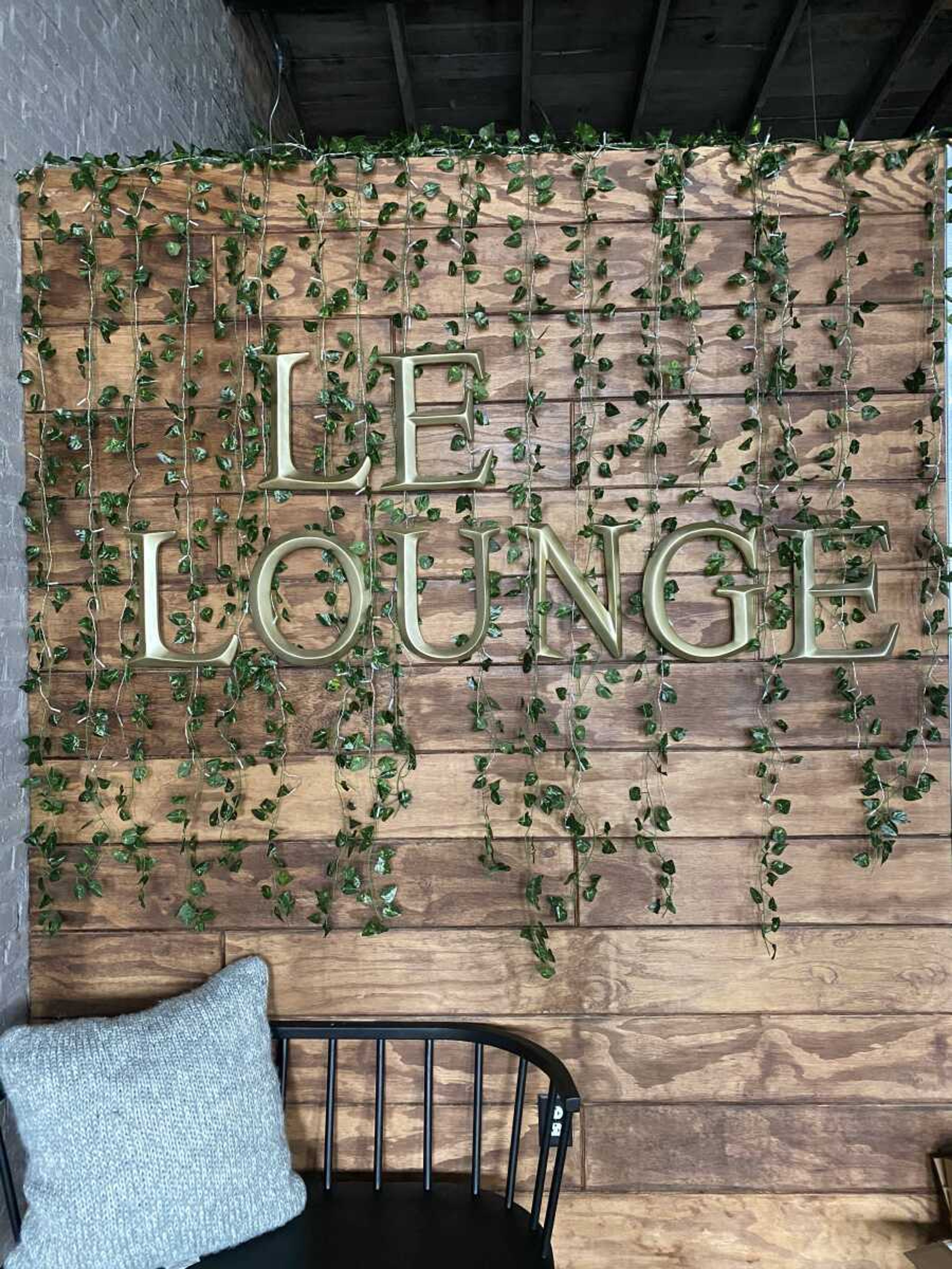 The Le Lounge backdrop guest will see once they walk up the stairs into the restaurant is covered in fake ivy. The restaurant is scheduled to open May 18, tentatively.