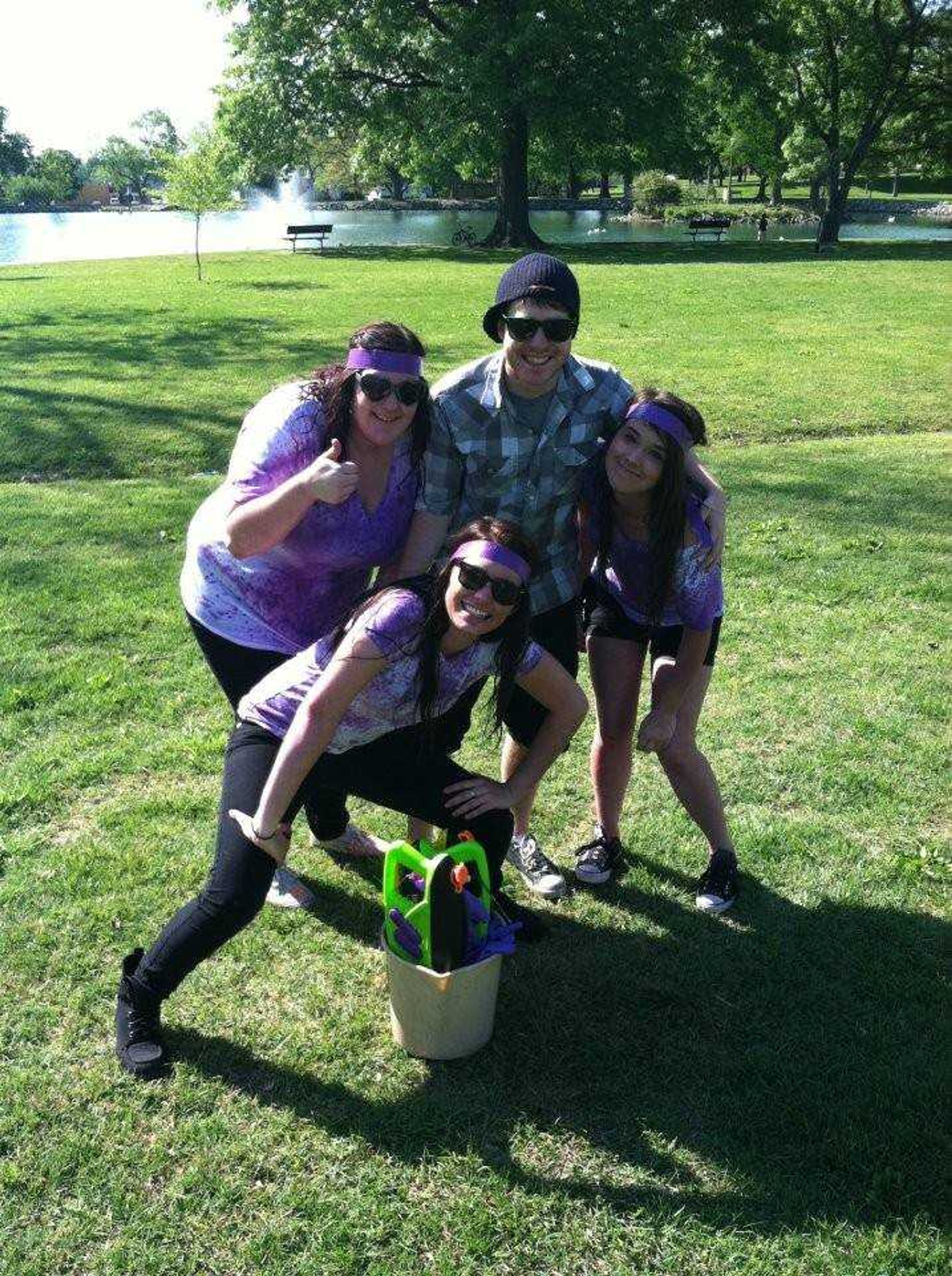 Southeast students Drew Jensen and Alex Nelson are collecting footage of students and organizations all over campus to create a music video in support of the Colleges Against Cancer society. In this picture, Jensen poses with students Jaime Clemens, Bri DeWitt and Tina Eaton, who have just had a water gun fight with purple clothing dye. Purple is the color designated to honor cancer survivors.