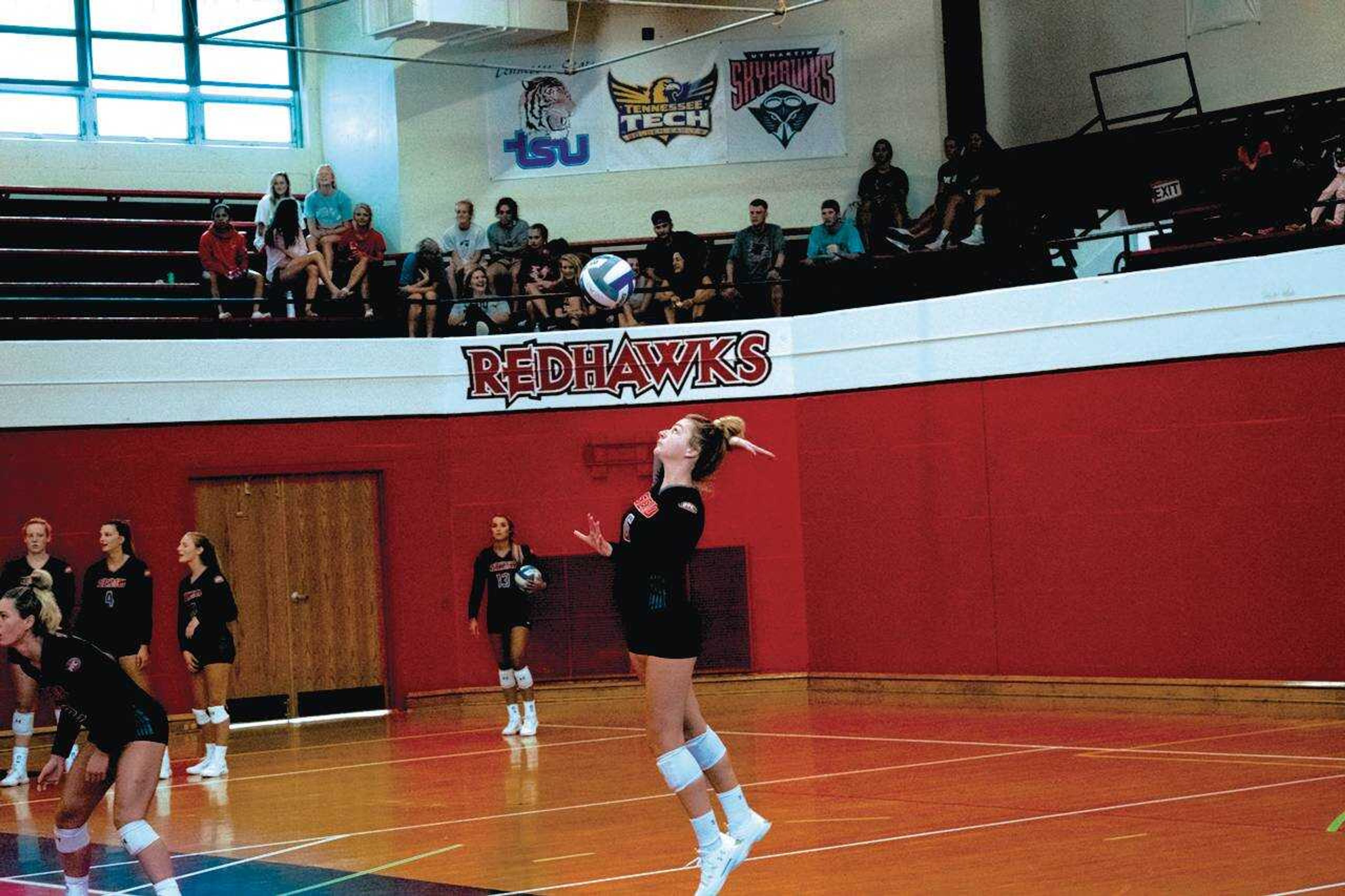 Junior defensive specialist Ally Dion serves in an exhibition match against Missouri Baptist University on Monday, Aug. 12 at Hock Field House. The Redhawks claimed victory in a three-set sweep.