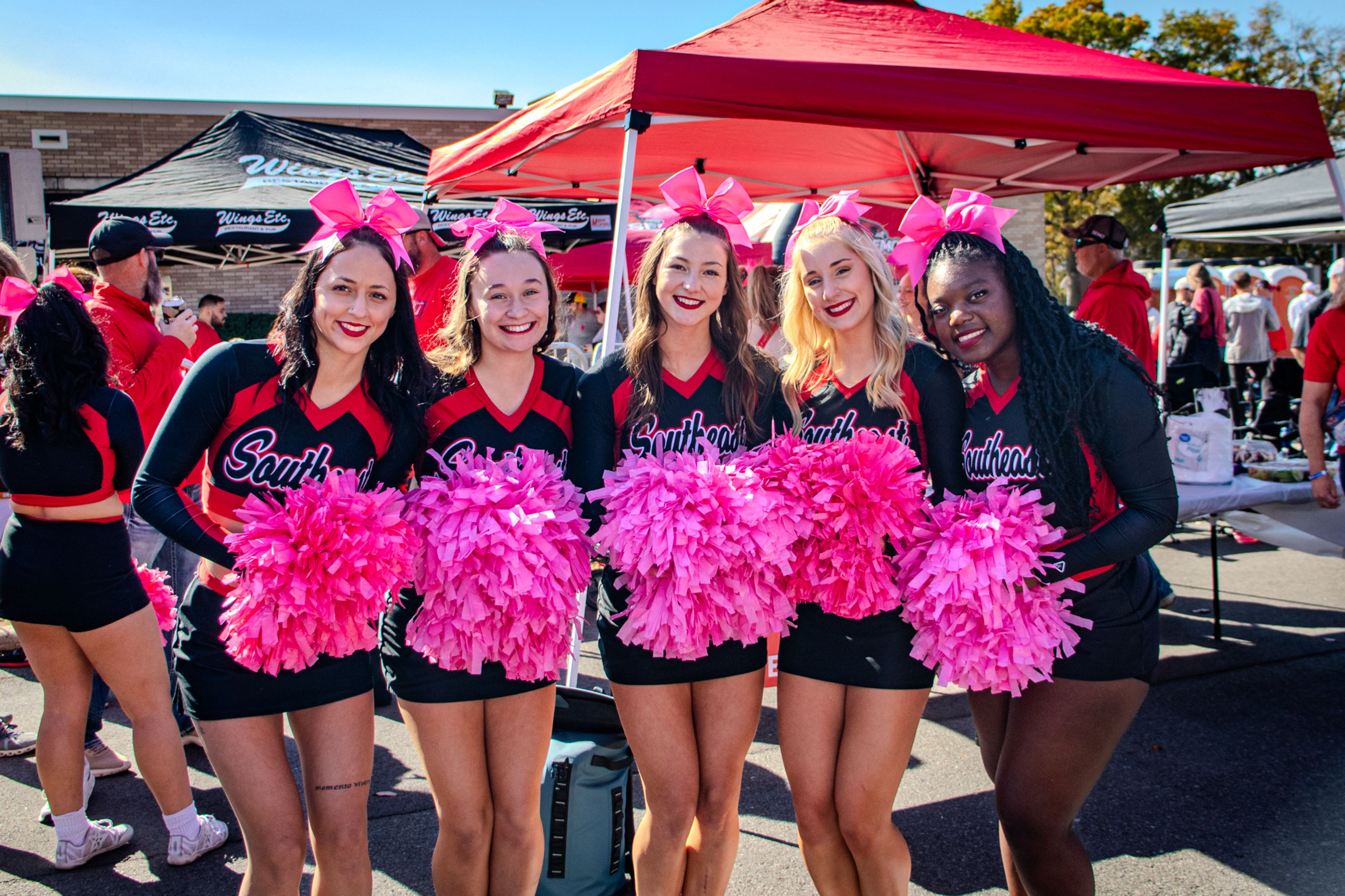 SEMO cheerleaders pose for a photo at the Alumni Association Tailgate. 