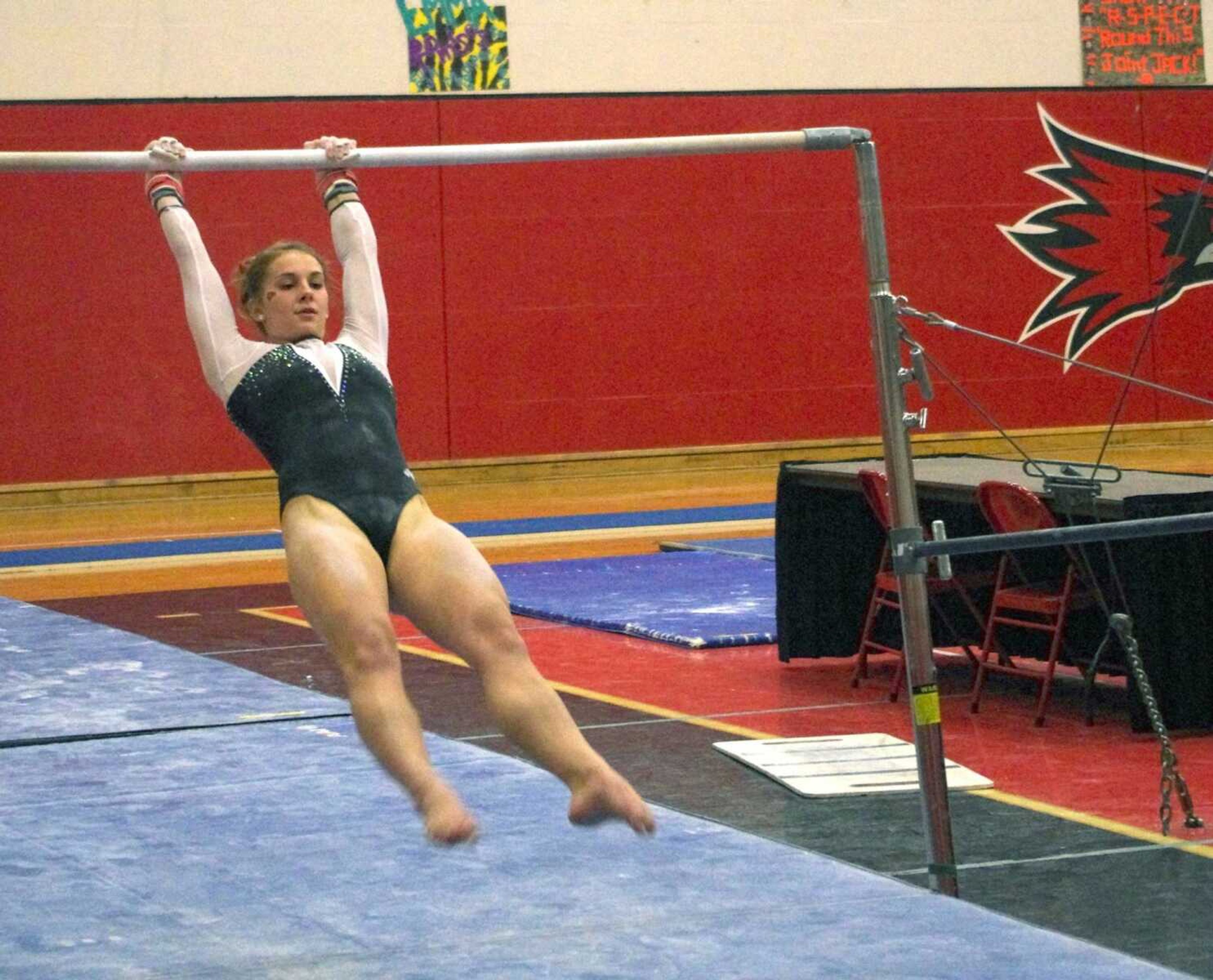 Taylor Westrick starts her bar routine at the gymnastics meet and greet that was held Friday at Houck Field House. Photo by Nathan Hamilton