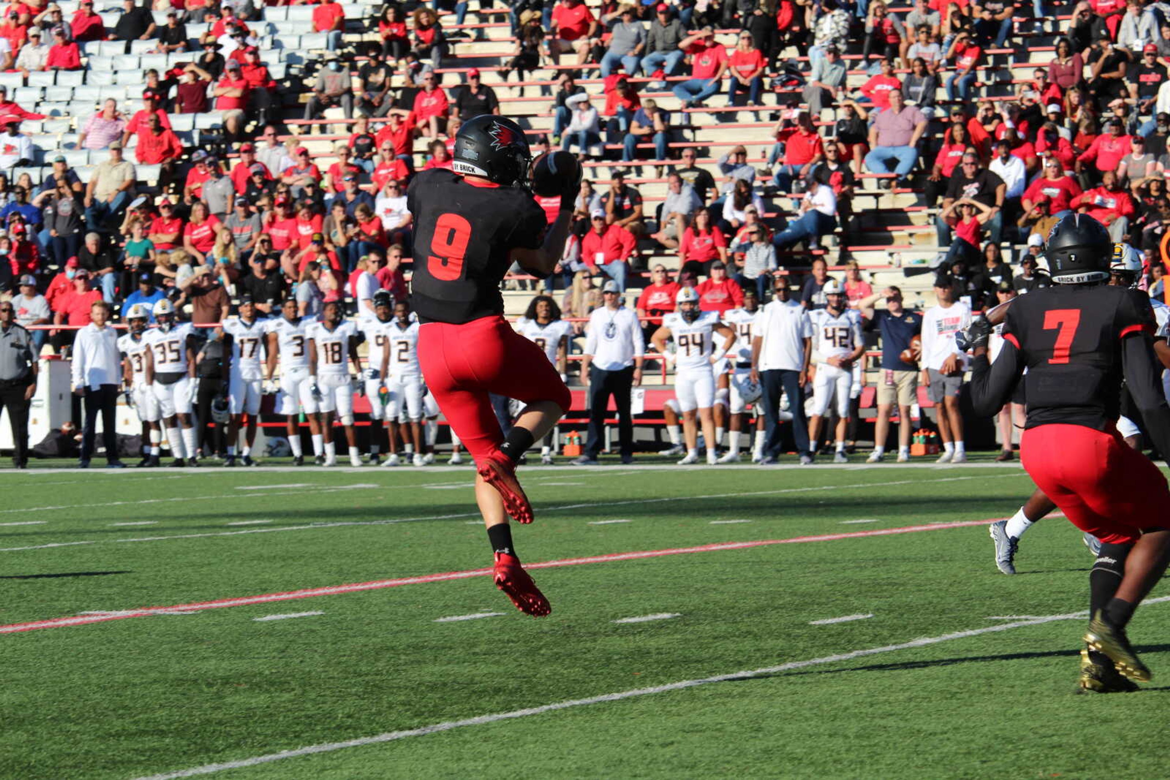 Graduate student Zack Smith makes a jumping catch during Southeast's game against Murray State on Oct. 16. The Redhawks fell to the Racers 32-31.