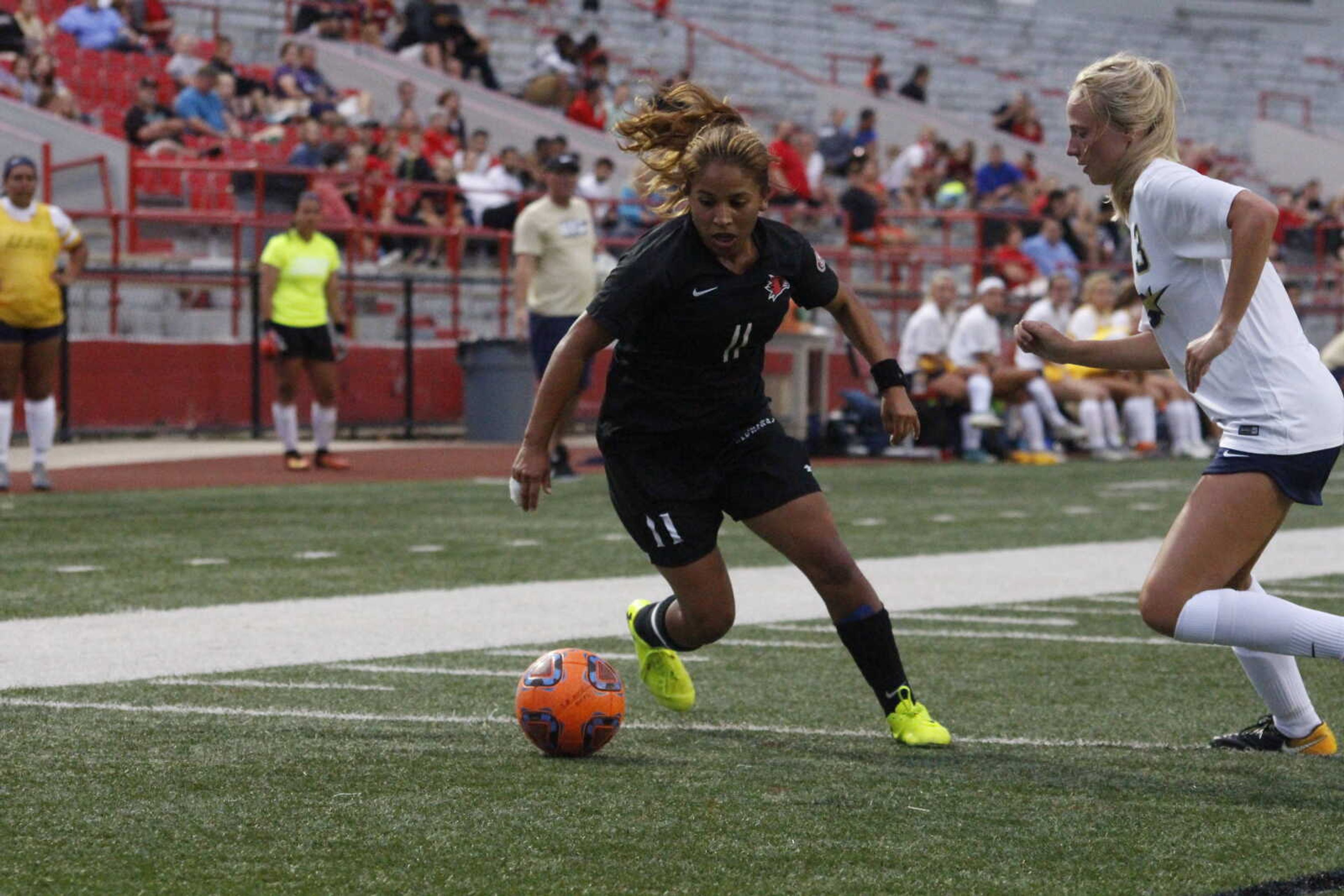 Junior midfielder Esmie Gonzales pushes the ball upfield in a match against the University of Illinois-Springfield on Aug. 24.