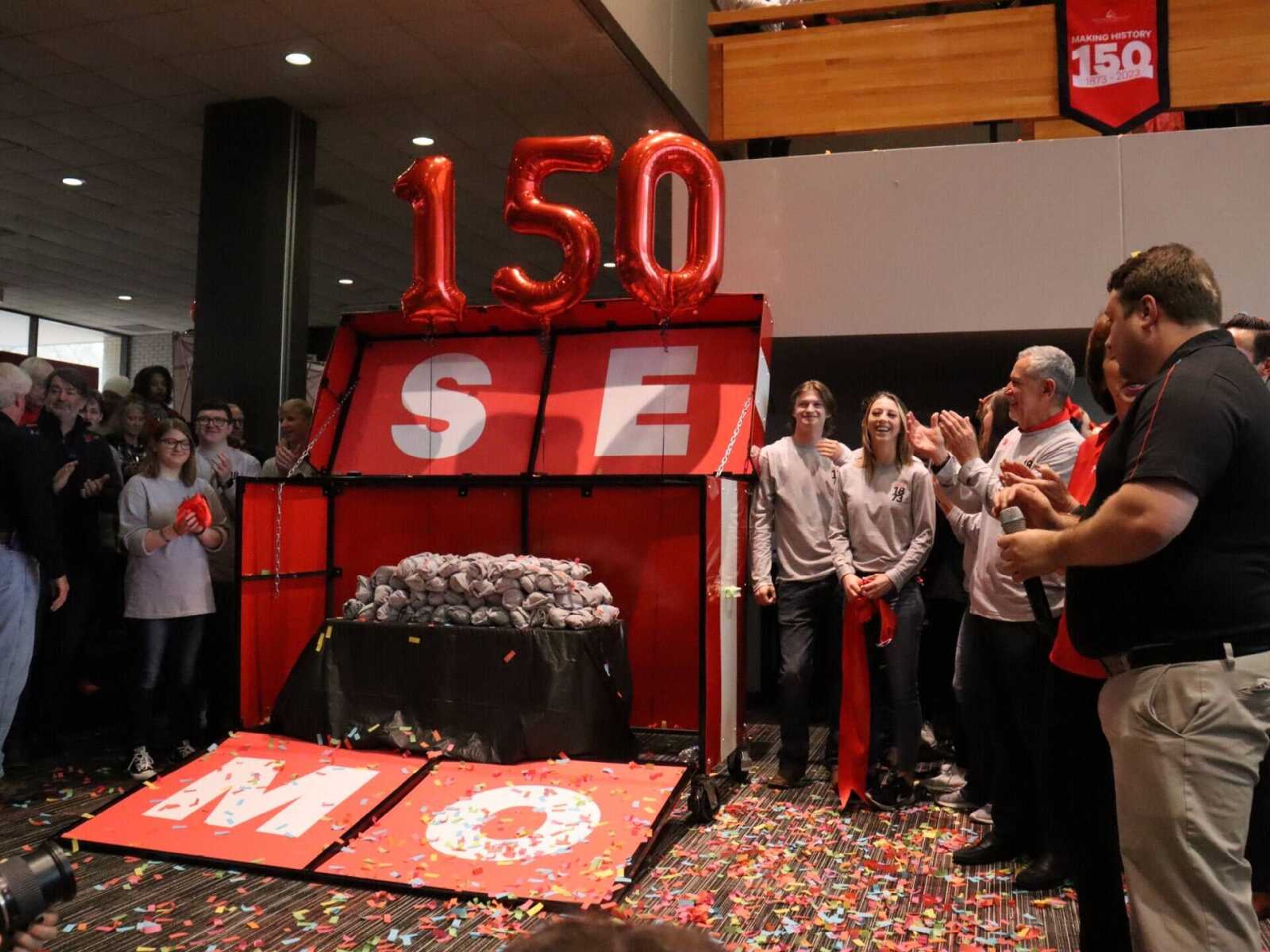 Students and public attendees gather around the 150th SEMO gift that was opened during the SEMO birthday celebration on March 22. Giving day also took place on March 22, and $150,000 was raised.