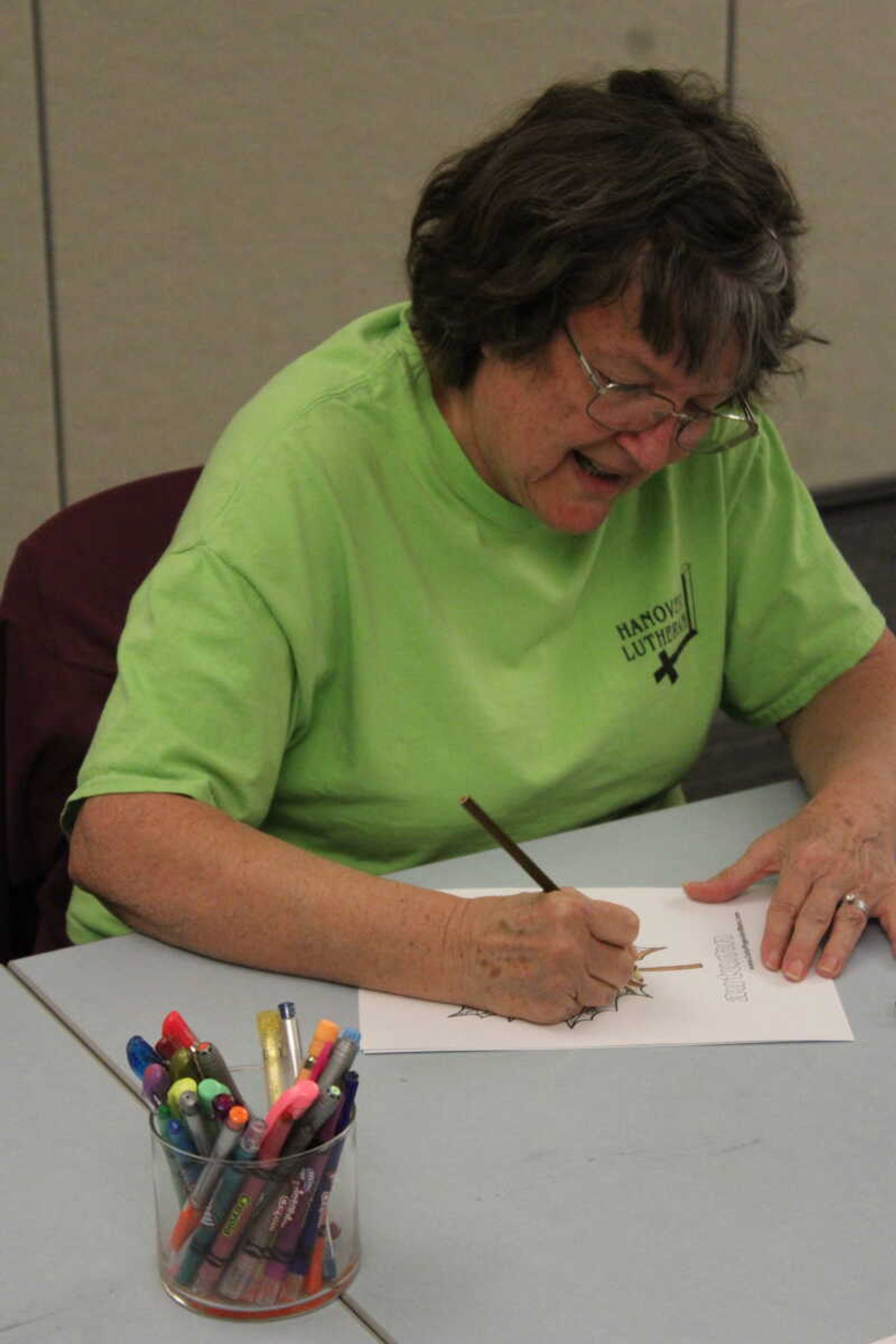 Dotty Behring colors in her design at Cape Girardeau Public Library’s “Coloring for Adults” event on Oct. 24.