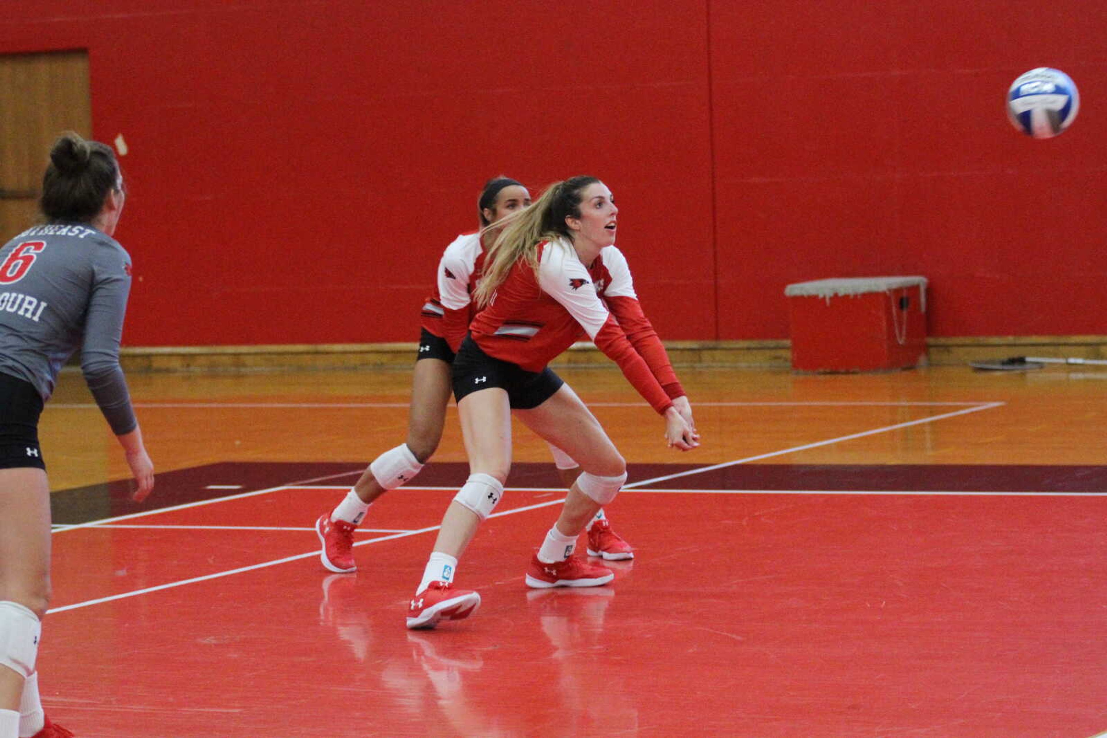 Sophomore Laney Malloy gets ready to bump the volleyball back to the opponent's side.