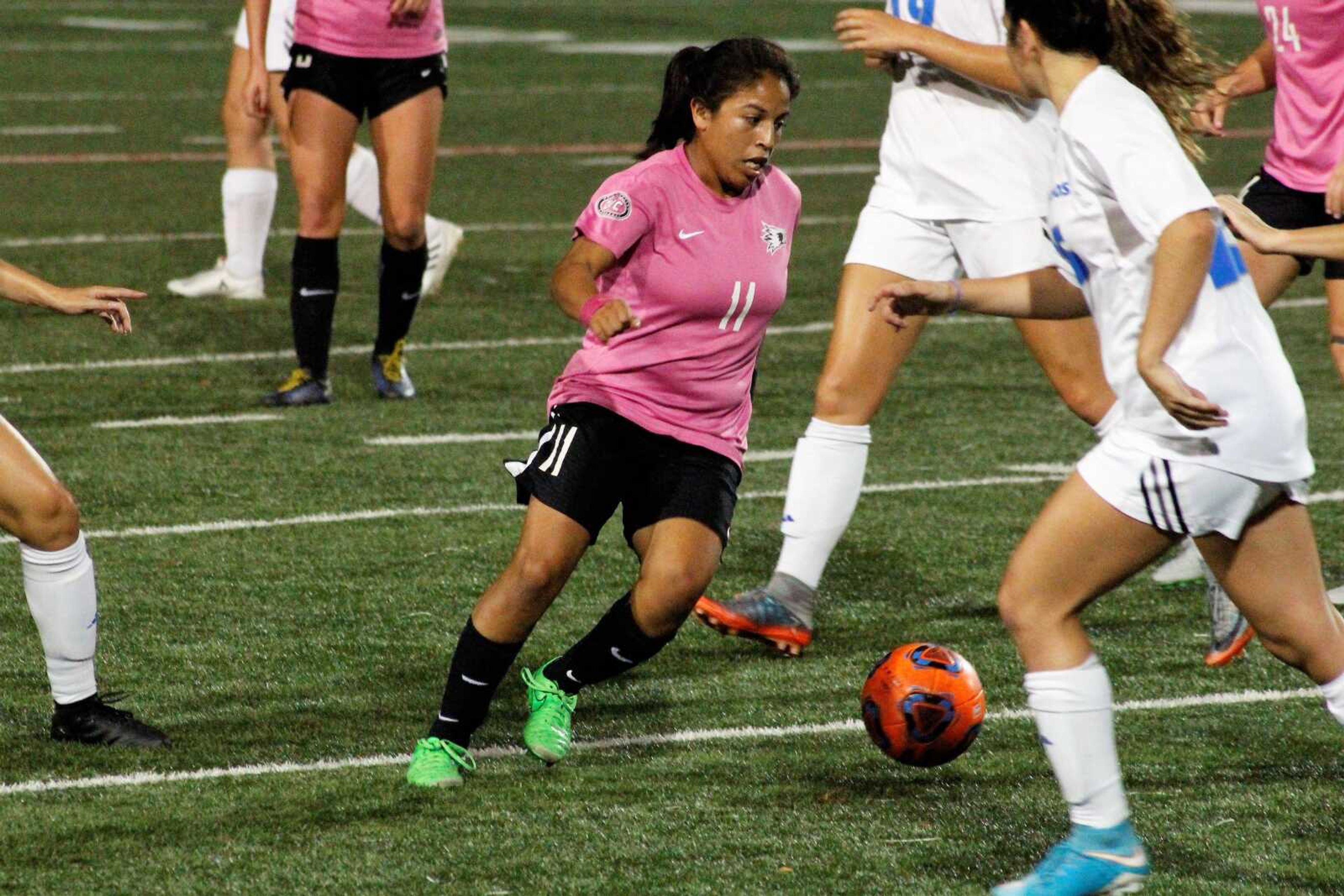 Sophomore, Esmie Gonzales  takes the ball downfield against the Panthers during the Oct.11 soccer game.
