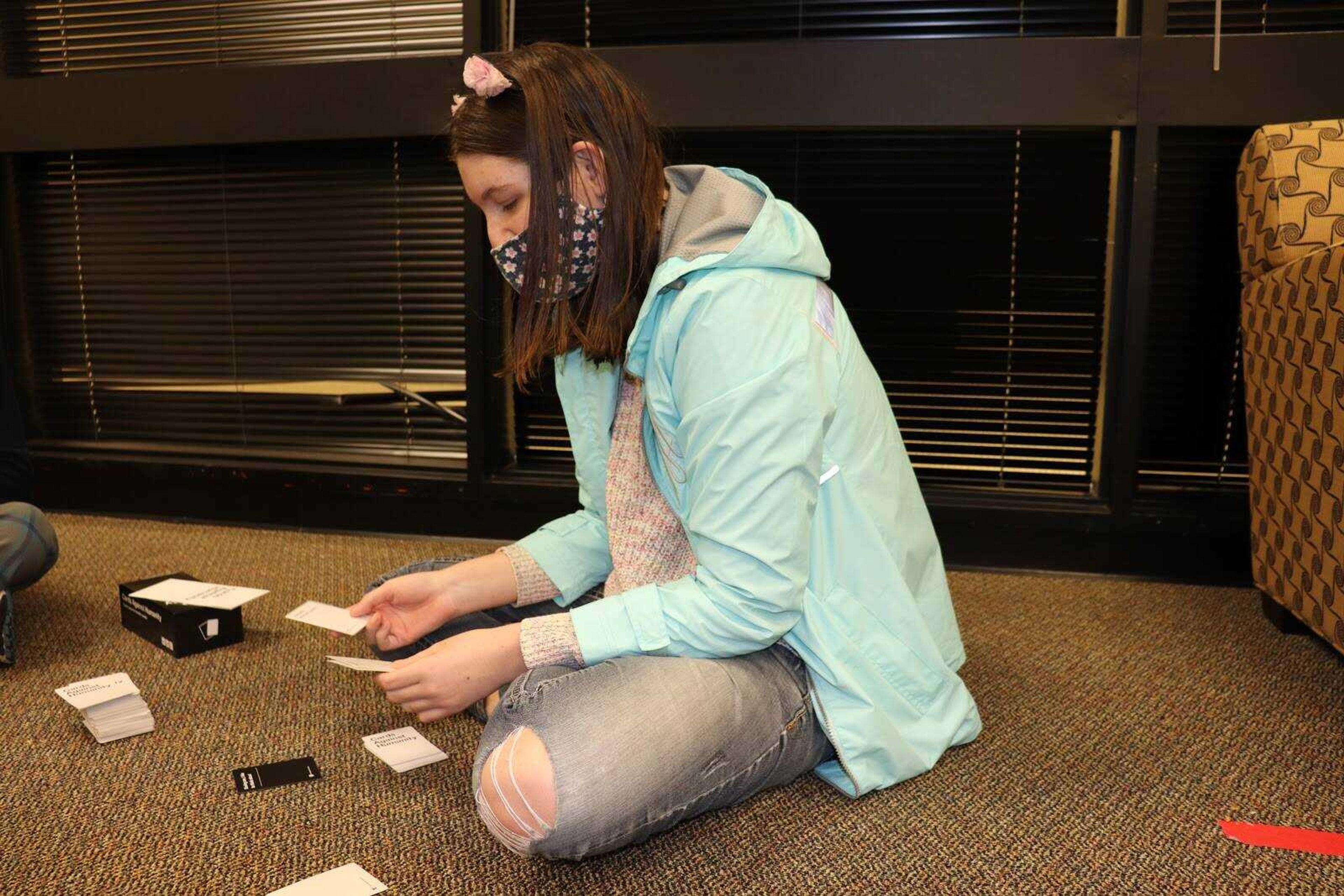 Elizabeth Pozaric dealing a round of Cards Against Humanity at a PRIDE meeting. Meetings are held every Thursday at 7 p.m. in the game room on the second floor of the University Center.