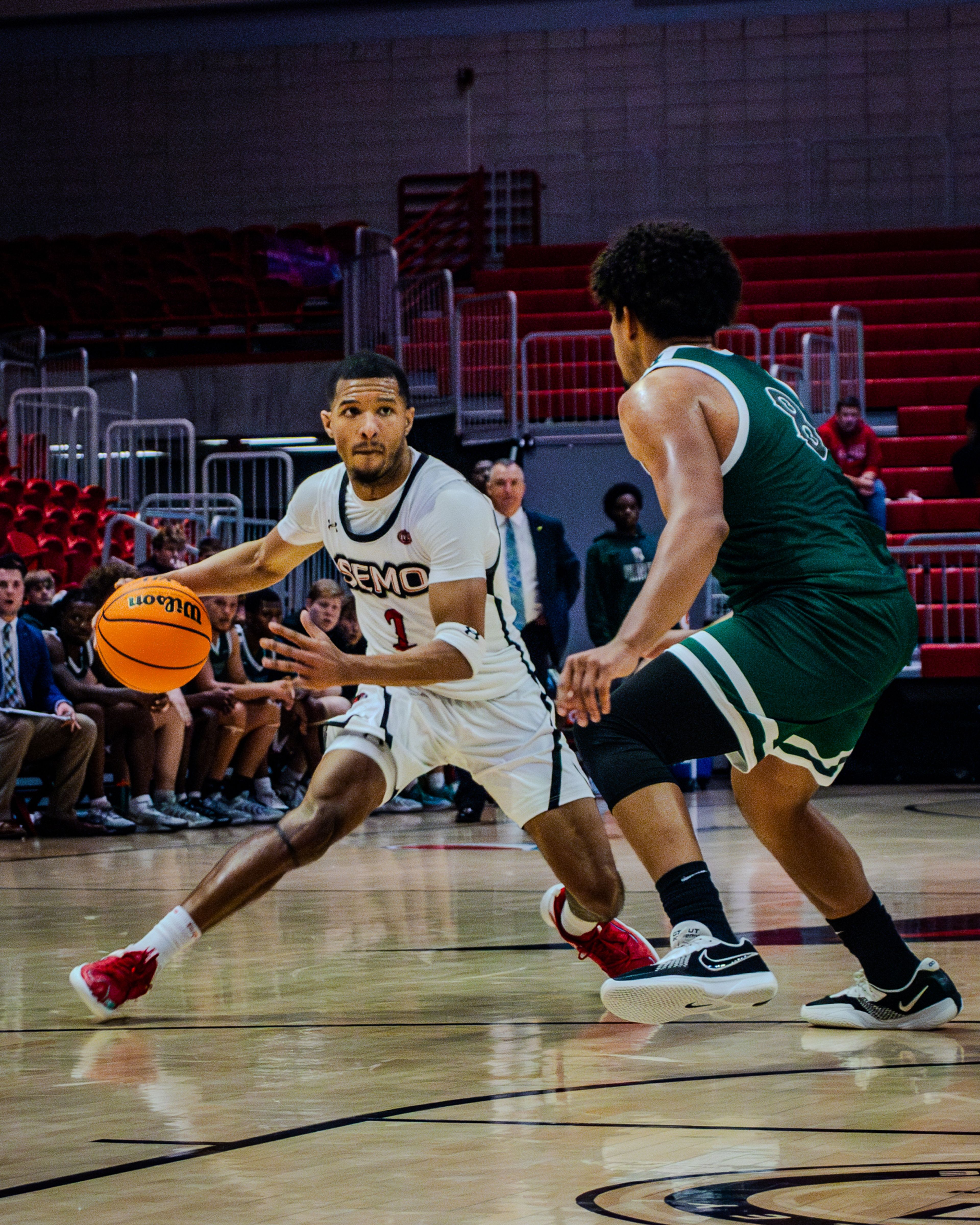 Junior guard Rob Martin dribbles against a Crowley Ridge College defender. 